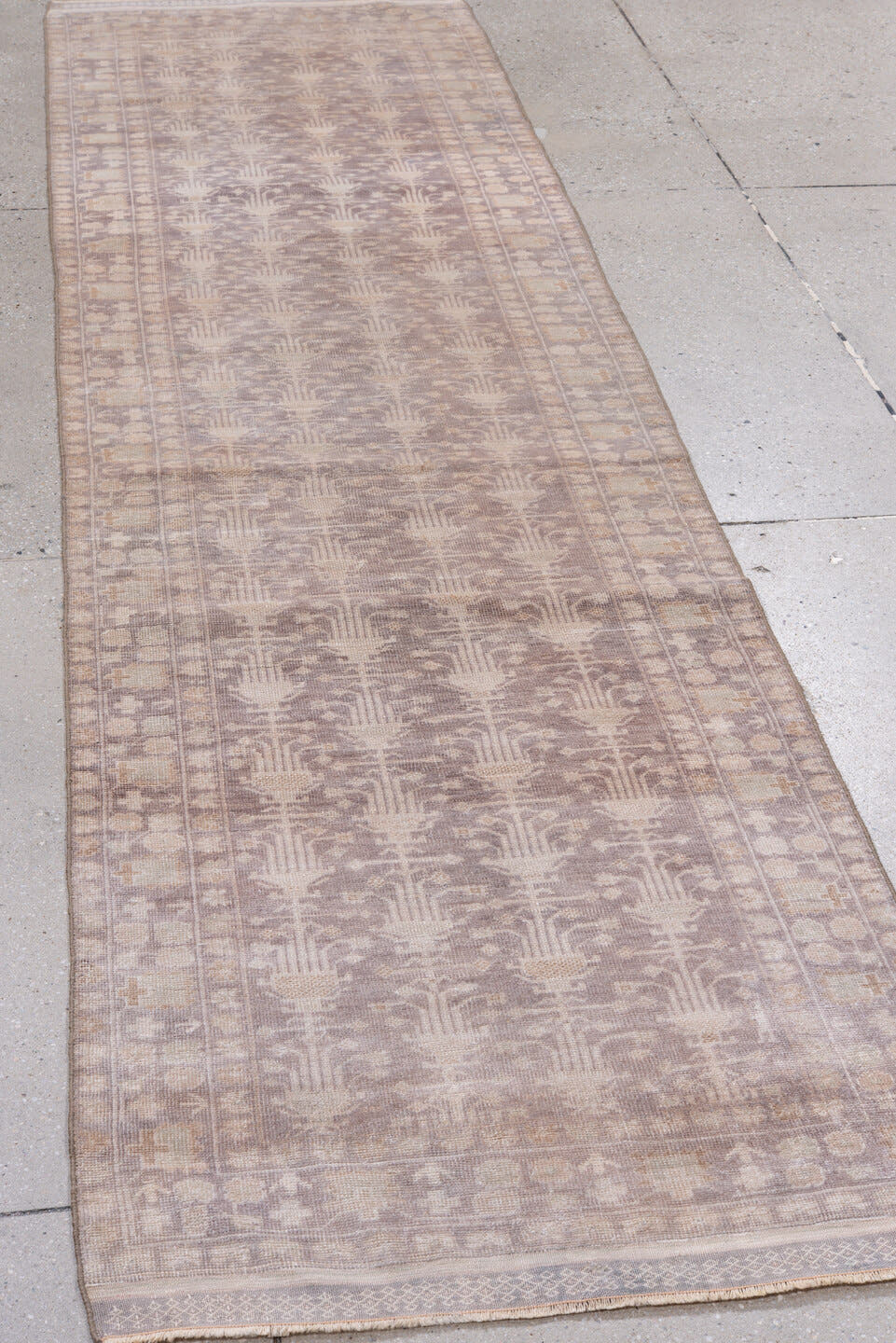 2' x 9' one-of-a-kind handmade antique Belouch runner rug. Color palette: taupe, ivory, dusty rose, beige, camel
