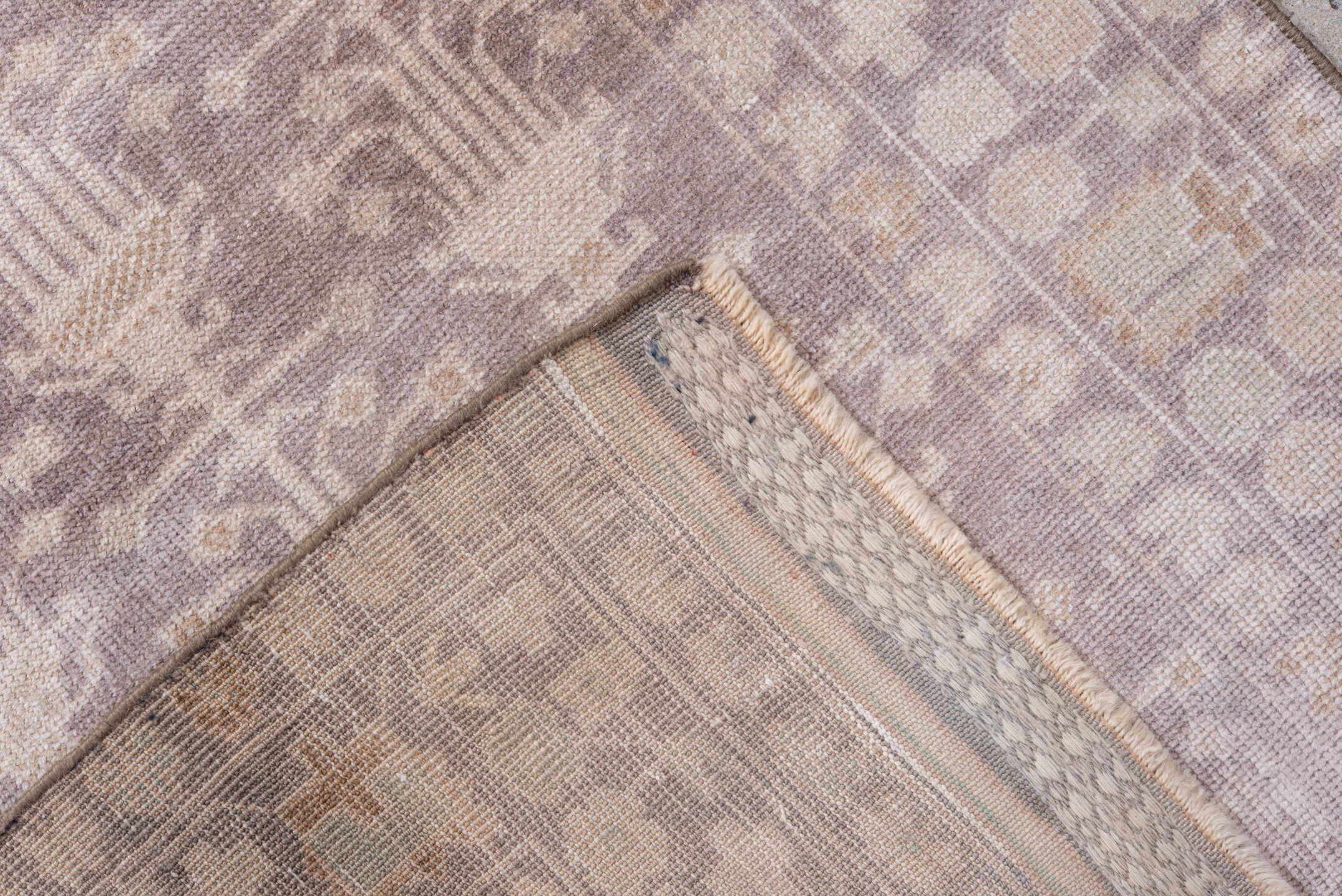 2' x 9' one-of-a-kind handmade antique Belouch runner rug. Color palette: taupe, ivory, dusty rose, beige, camel