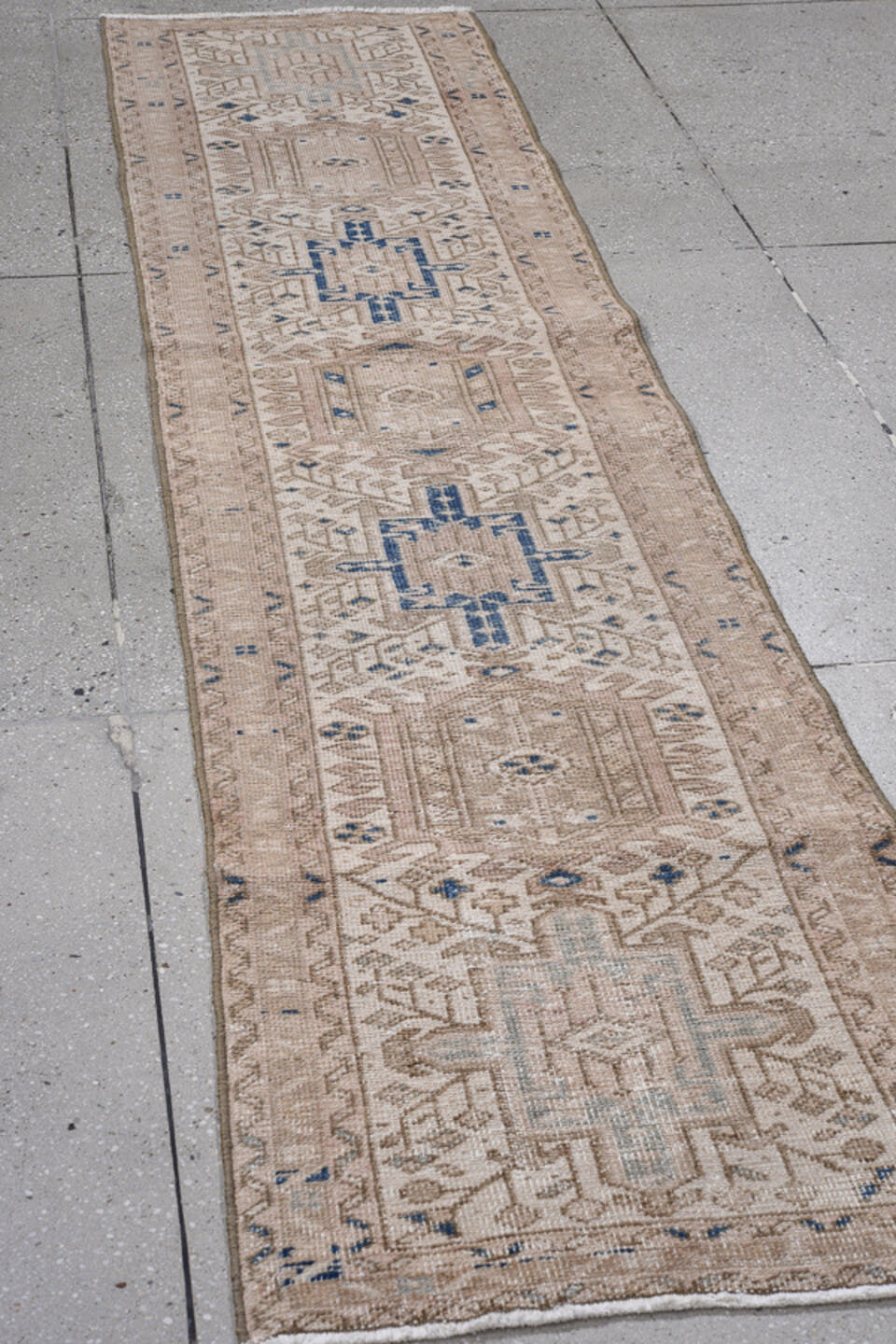 2' x 8' one-of-a-kind handmade antique Karaje runner rug. Color palette: beige, ivory, taupe, slate, navy, camel, gray, blue