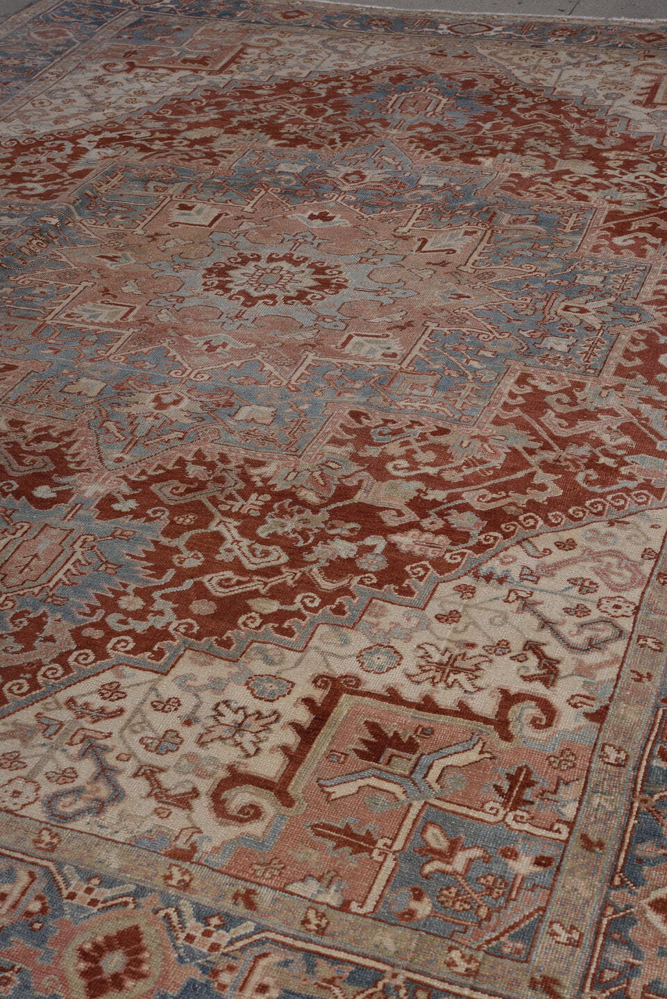 8' x 11' one-of-a-kind handmade antique Heriz large size rug. Color palette: ivory, rust, sky blue, blush, terra cotta