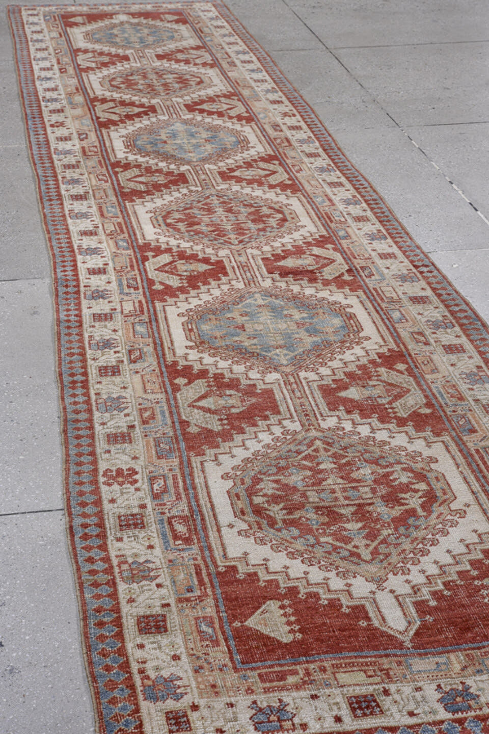 3' x 14' one-of-a-kind handmade antique Sarab runner rug. Color palette: rust, ivory, sky_blue, brick, camel, taupe