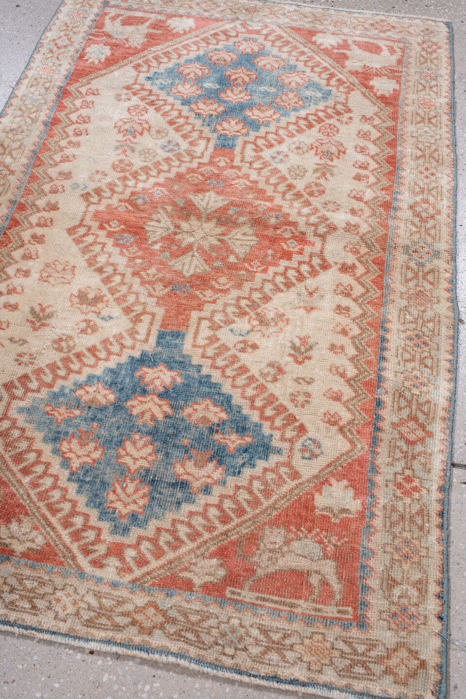2' x 4' one-of-a-kind handmade antique Shiraz small size rug. Color palette: ivory, coral, sky blue, taupe, camel
