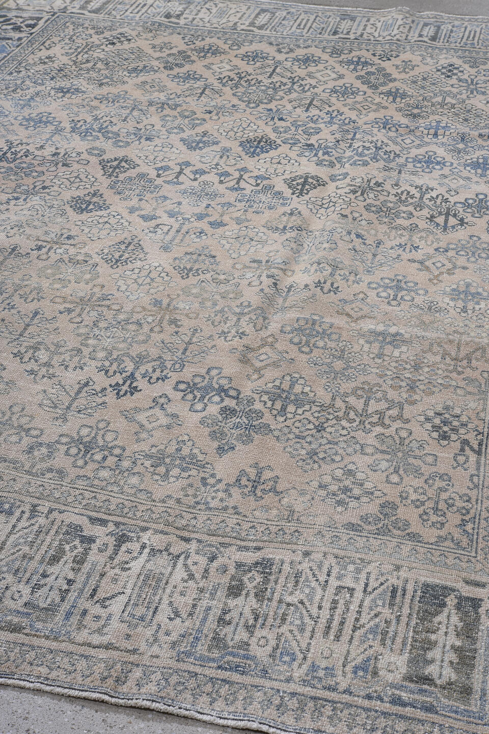 7' x 10' one-of-a-kind handmade antique Joshegan large size rug. Color palette: ivory, blue, slate, taupe, cream, gray