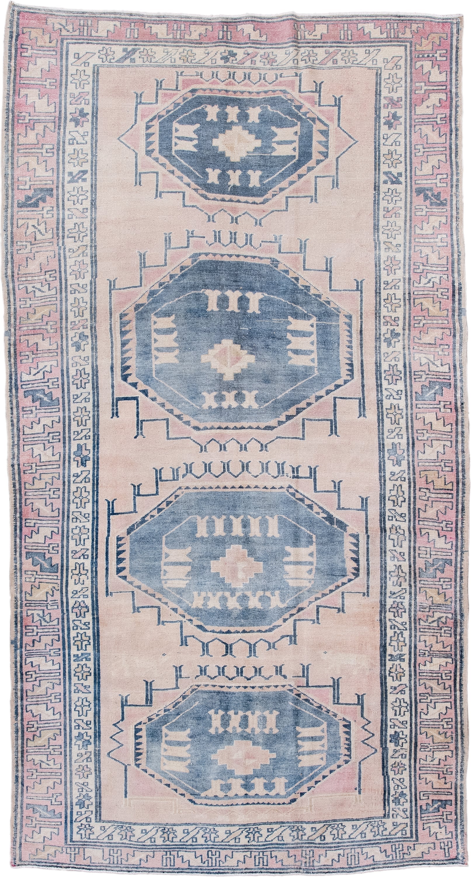 5' x 9' one-of-a-kind handmade antique Caucasian medium size rug. Color palette: blush, blue, ivory, navy, rose, cream, pink