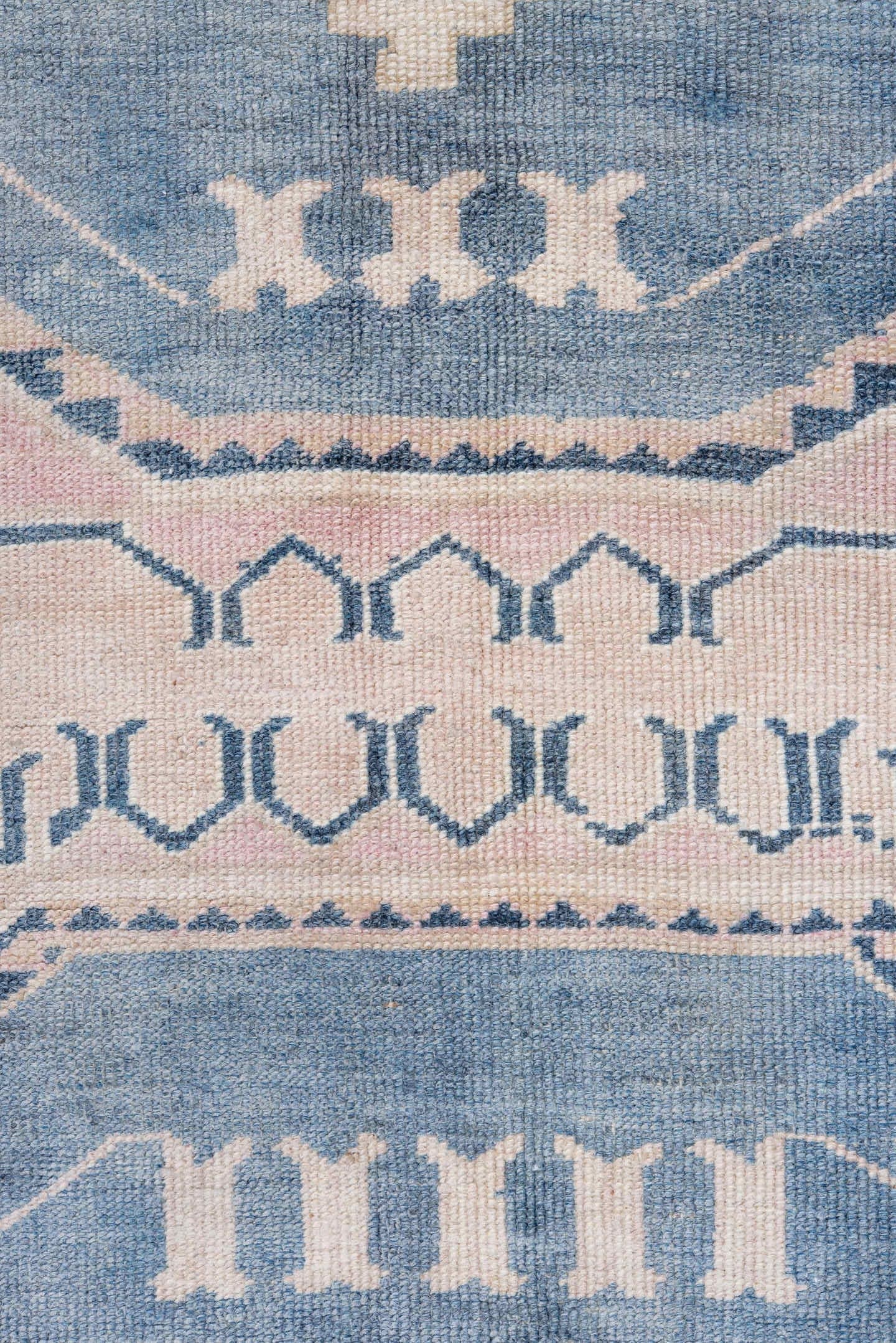 5' x 9' one-of-a-kind handmade antique Caucasian medium size rug. Color palette: blush, blue, ivory, navy, rose, cream, pink