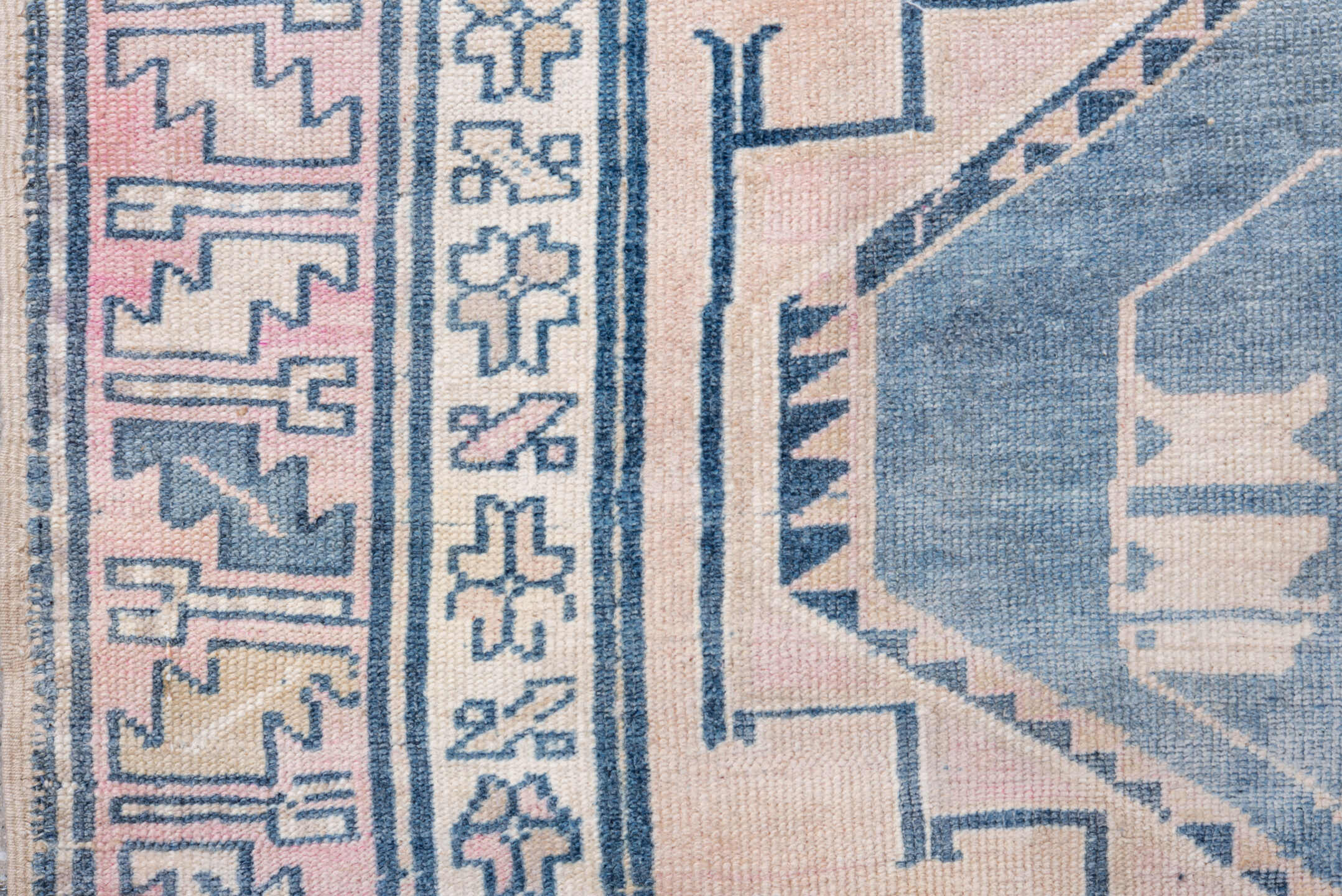 5' x 9' one-of-a-kind handmade antique Caucasian medium size rug. Color palette: blush, blue, ivory, navy, rose, cream, pink