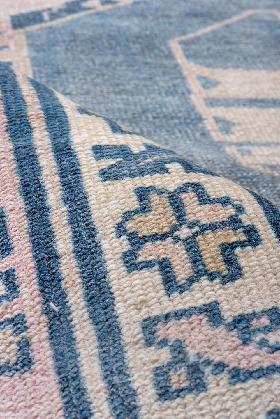 5' x 9' one-of-a-kind handmade antique Caucasian medium size rug. Color palette: blush, blue, ivory, navy, rose, cream, pink