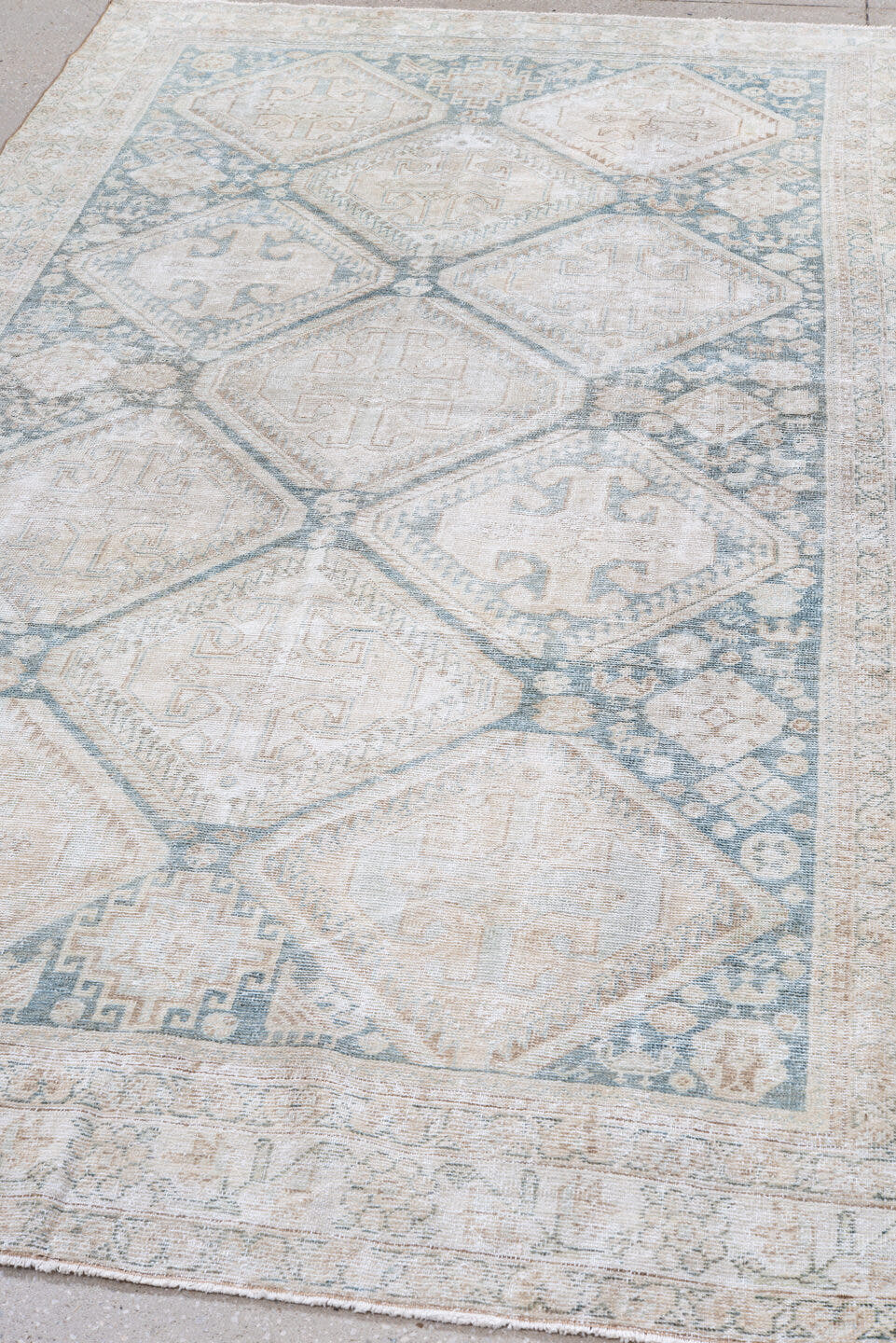 5' x 9' one-of-a-kind handmade antique Farahan medium size rug. Color palette: ivory, pale blue, sand, beige, taupe