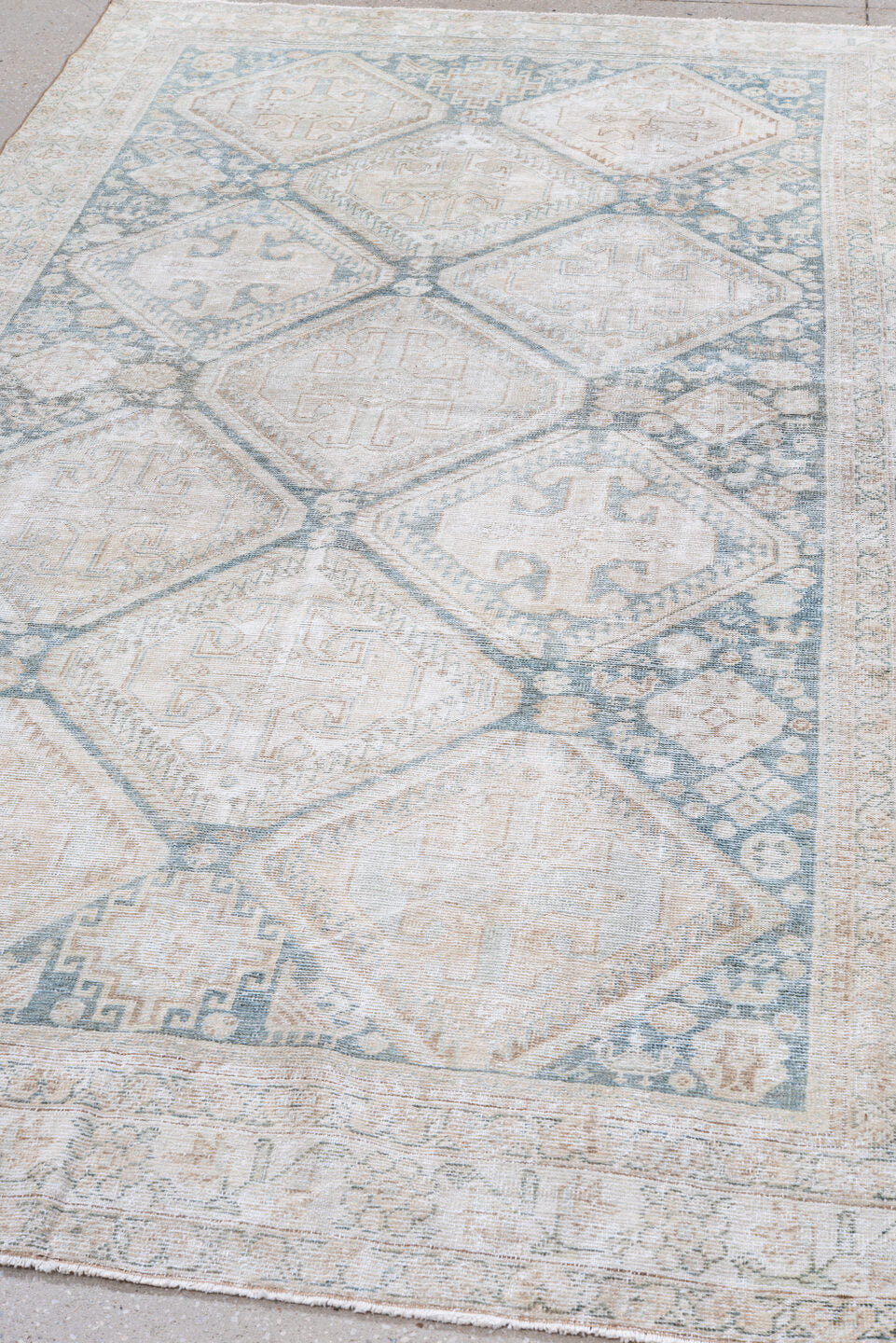 5' x 9' one-of-a-kind handmade vintage Farahan medium size rug. Color palette: gray, off-white, light gray, light blue, pink