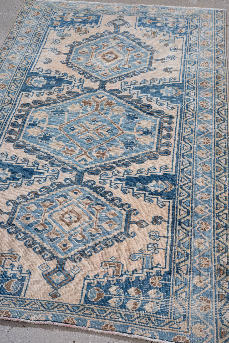 3' x 6' one-of-a-kind handmade vintage Veece small size rug. Color palette: ivory, sky blue, camel, navy, taupe, light blue