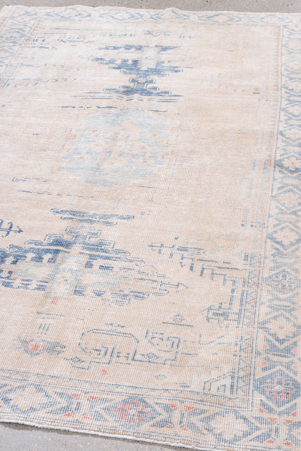 4' x 7' one-of-a-kind handmade vintage Veece rug. Color palette: ivory, pale blue, blush, sky blue, faded coral, light blue