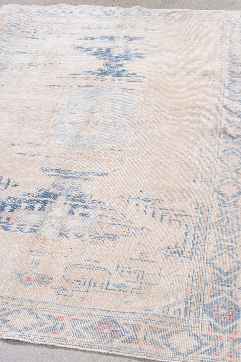 4' x 7' one-of-a-kind handmade vintage Veece rug. Color palette: ivory, pale blue, blush, sky blue, faded coral, light blue