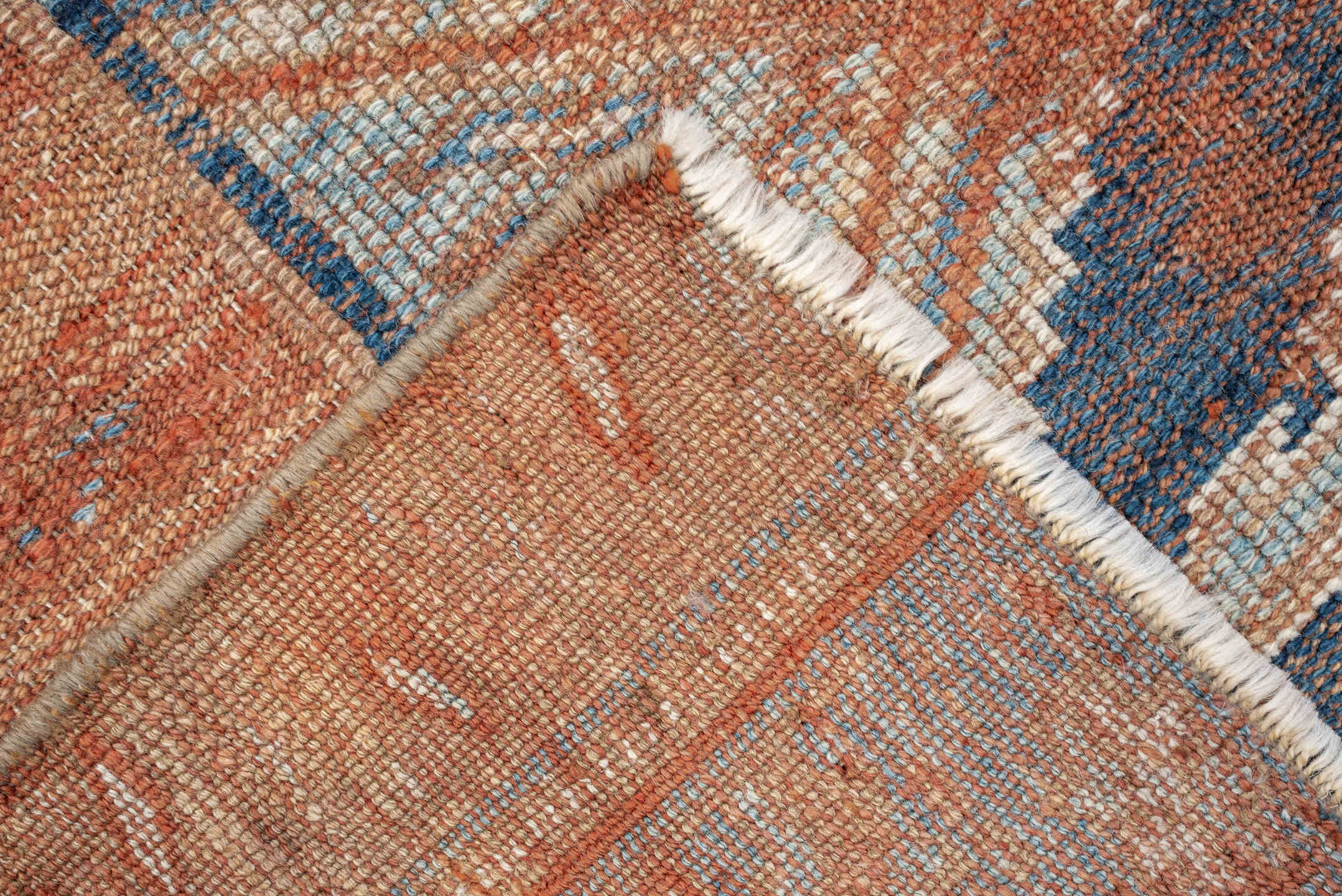 4' x 7' one-of-a-kind handmade antique Kurd rug. Color palette: terracotta, powder blue, ivory, camel, taupe, rust, brown