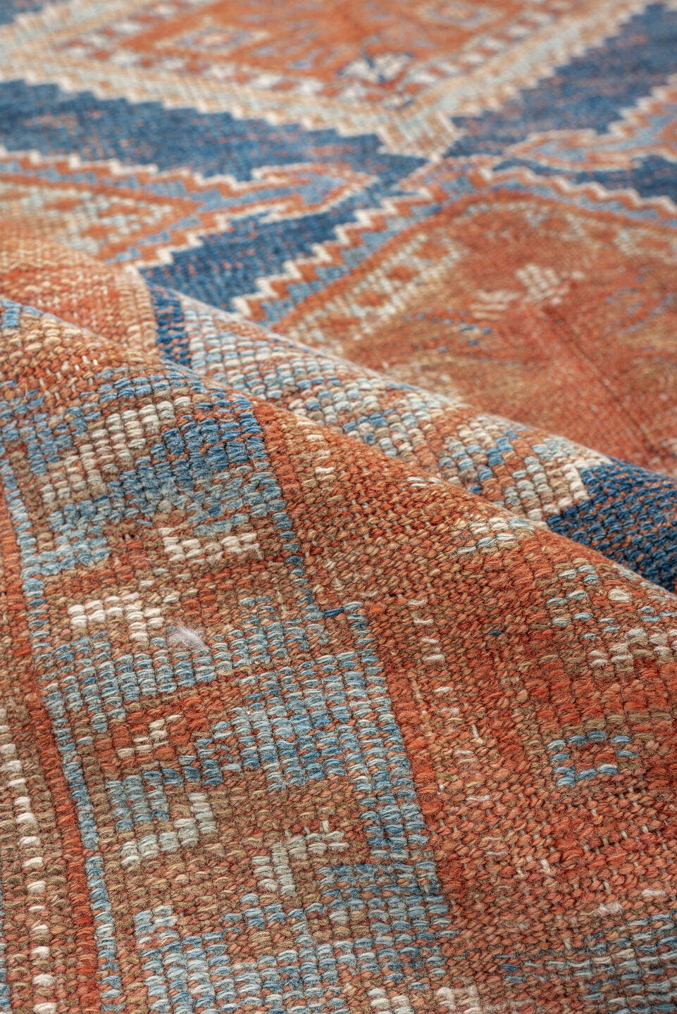 4' x 7' one-of-a-kind handmade antique Kurd rug. Color palette: terracotta, powder blue, ivory, camel, taupe, rust, brown