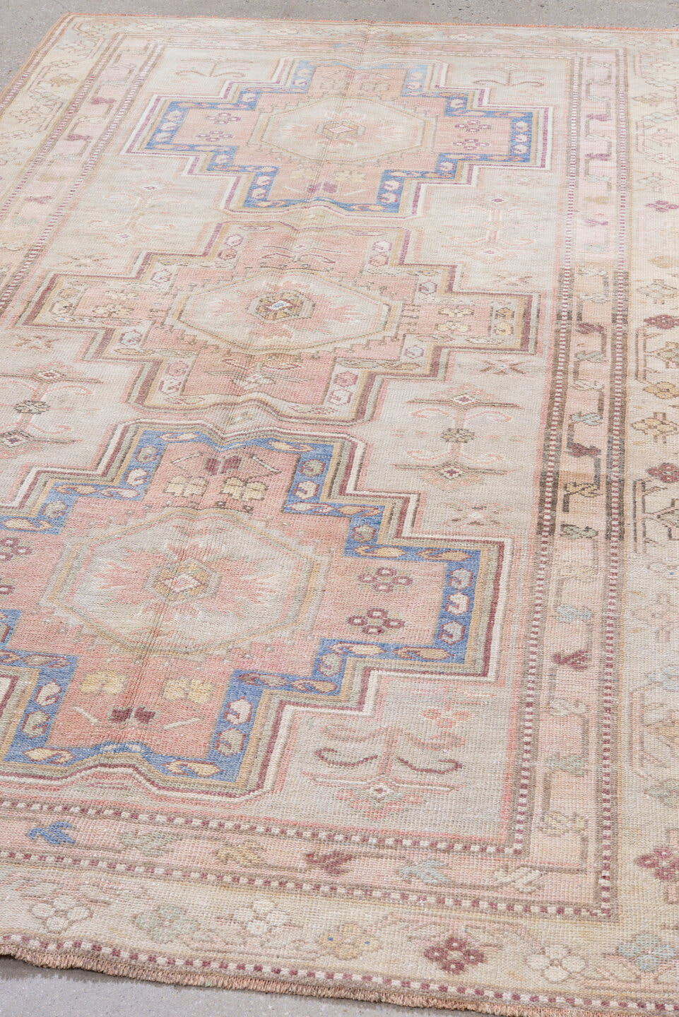 4' x 8' one-of-a-kind handmade antique Caucasian rug. Color palette: ivory, blush, rose, sky blue, taupe, dusty pink, sage