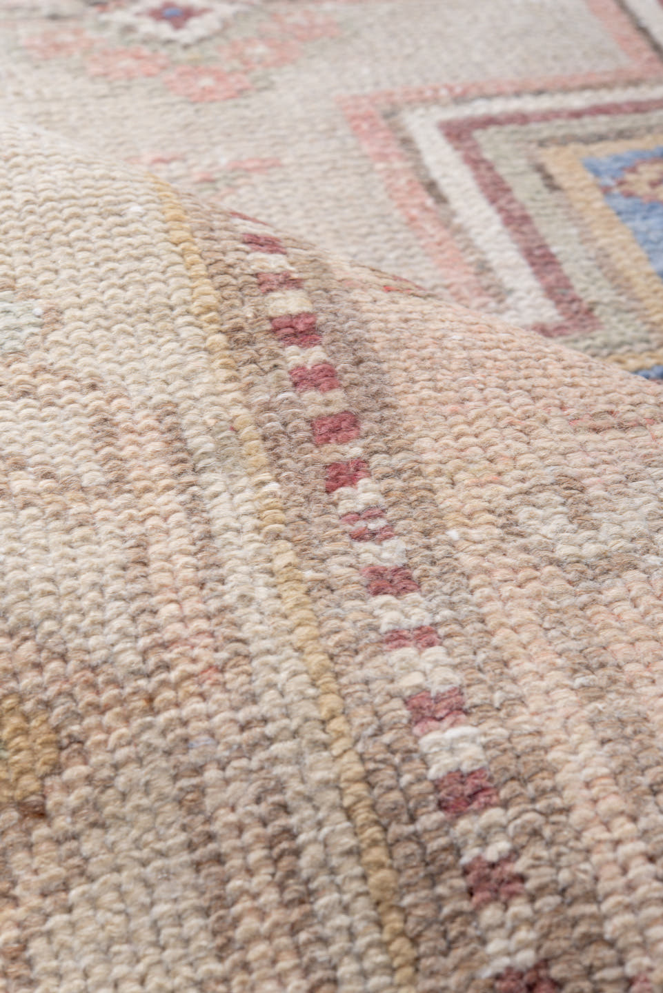 4' x 8' one-of-a-kind handmade antique Caucasian rug. Color palette: ivory, blush, rose, sky blue, taupe, dusty pink, sage
