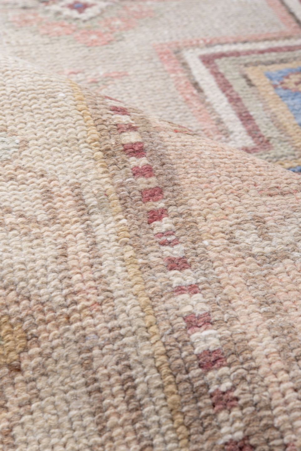 4' x 8' one-of-a-kind handmade antique Caucasian rug. Color palette: ivory, blush, rose, sky blue, taupe, dusty pink, sage