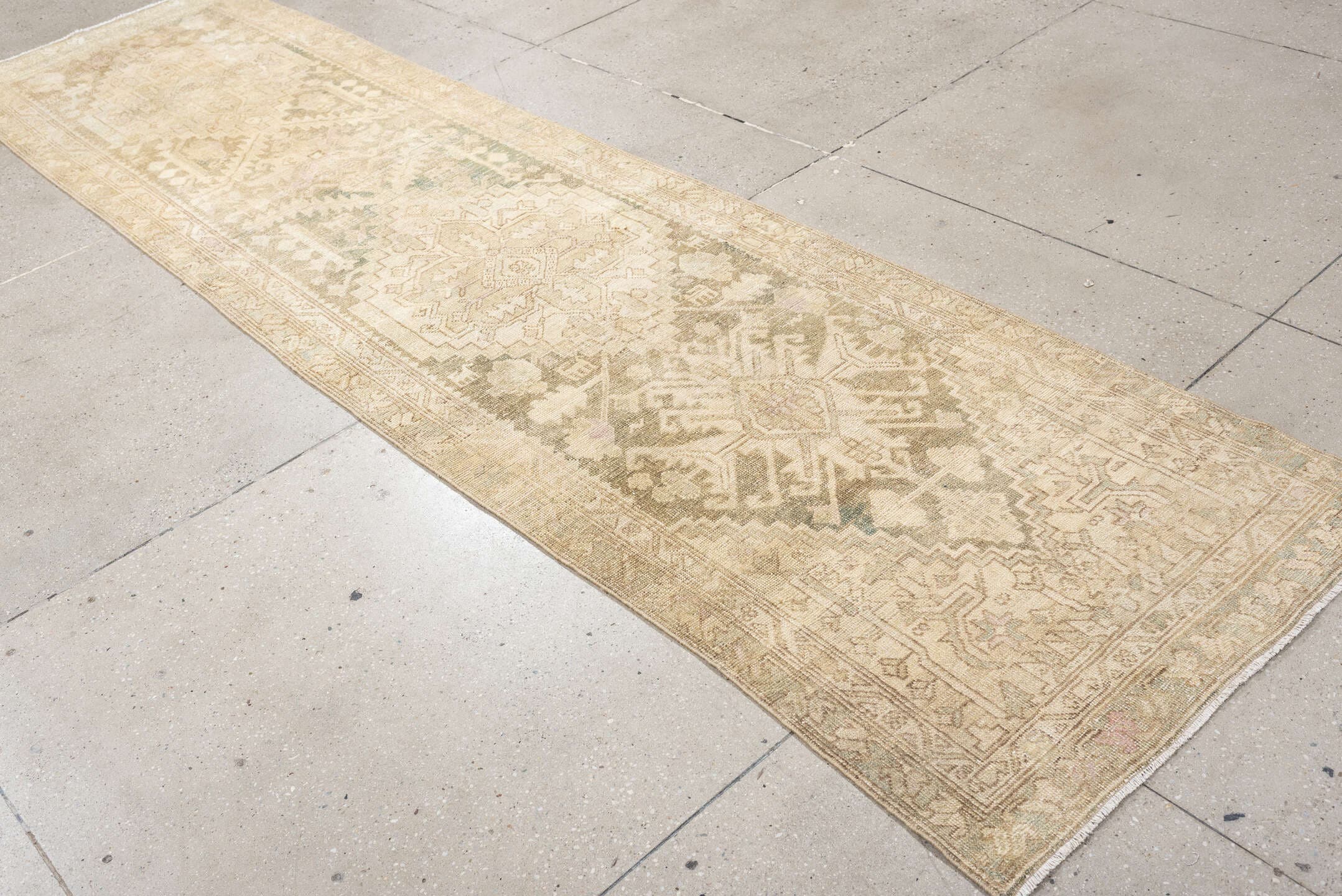 2' x 11' one-of-a-kind handmade antique Sarab runner rug. Color palette: ivory, taupe, beige, sage, pale rust, camel, brown