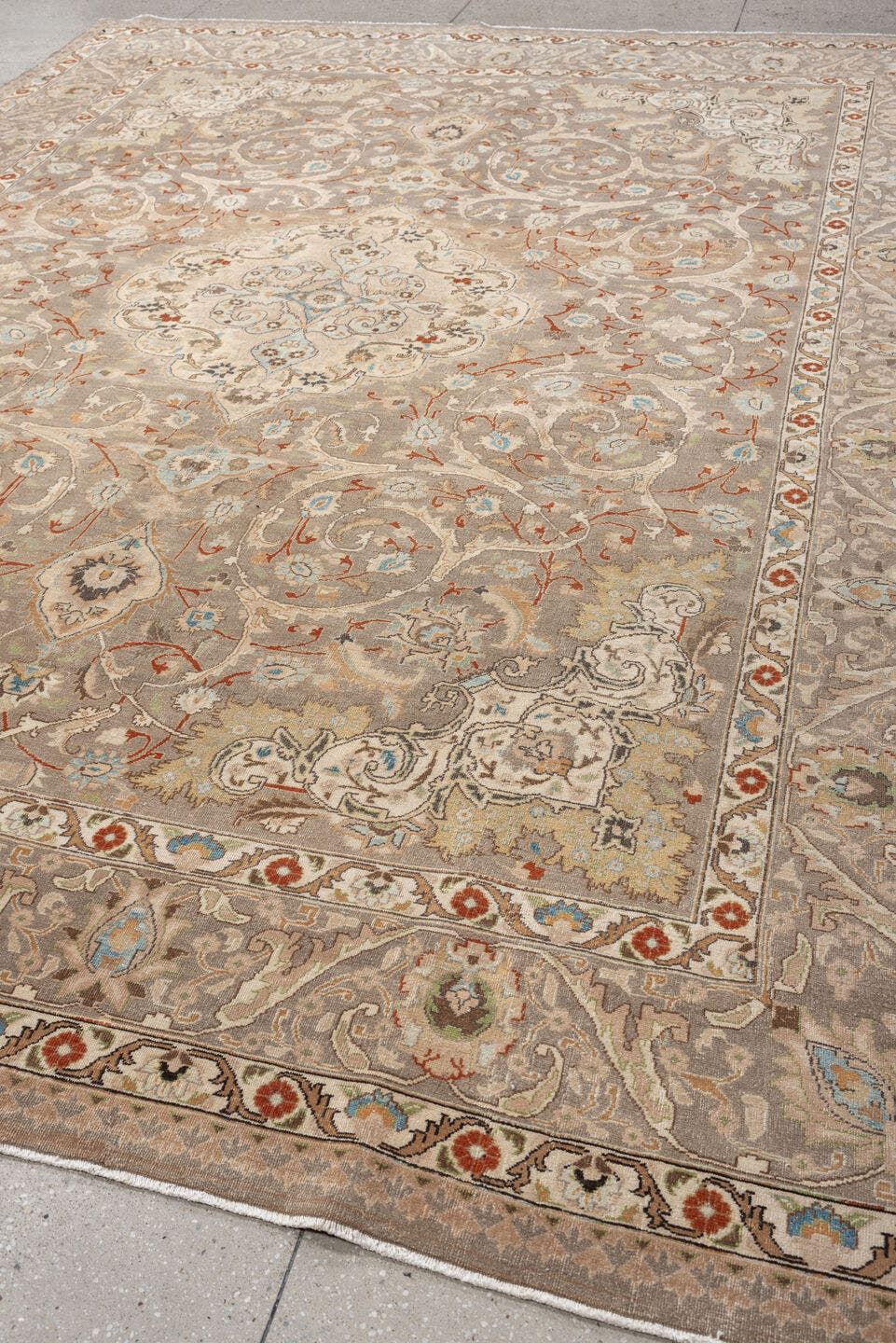 9' x 12' one-of-a-kind handmade vintage Tabriz large size rug. Color palette: taupe, ivory, camel, pale blue, rust, cream
