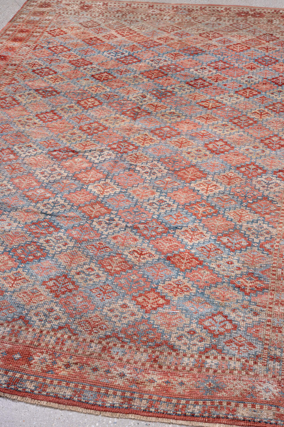 5' x 7' one-of-a-kind handmade antique Kurd rug. Color palette: coral, dusty blue, ivory, rust, rose, taupe, terracotta