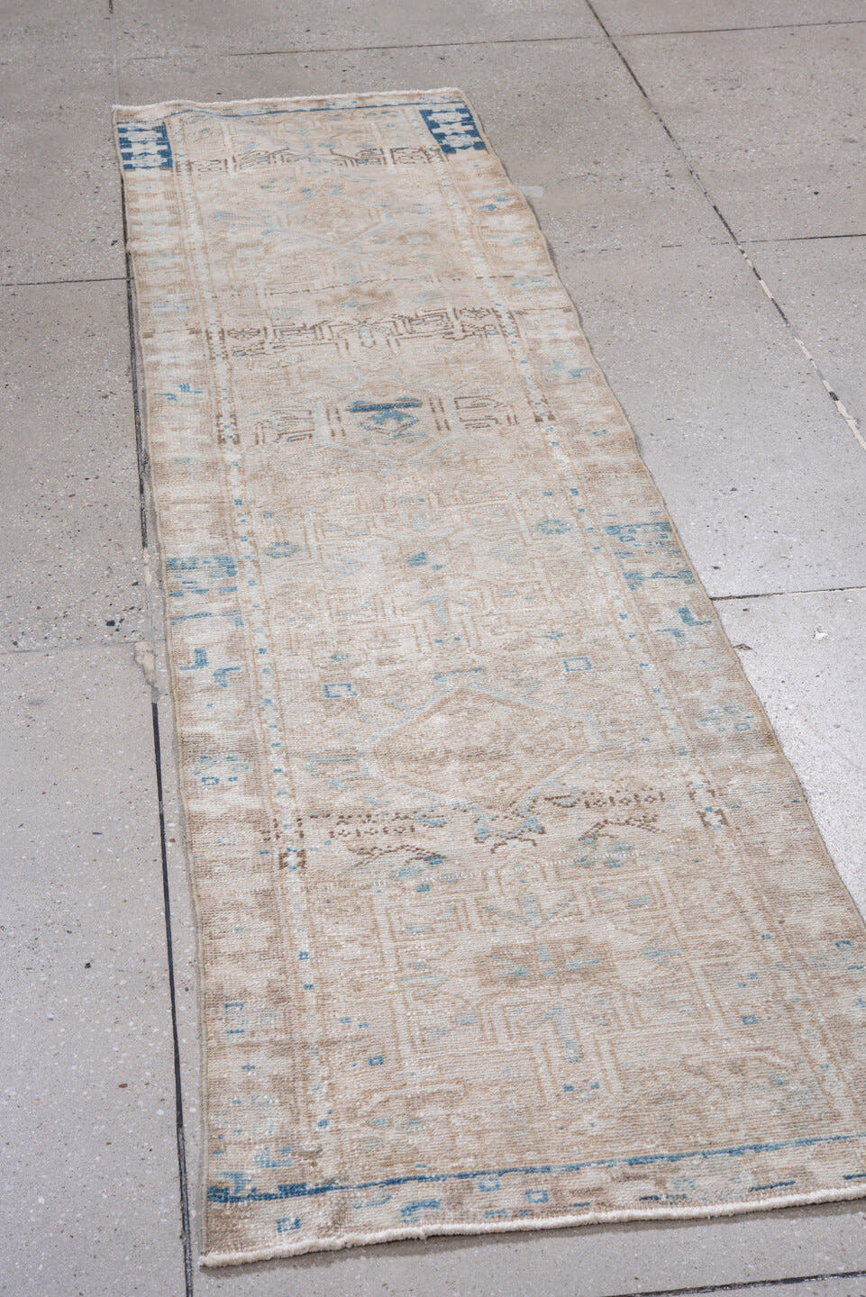 2' x 8' one-of-a-kind handmade vintage Karaje runner rug. Color palette: ivory, taupe, sky_blue, beige, slate_blue, camel