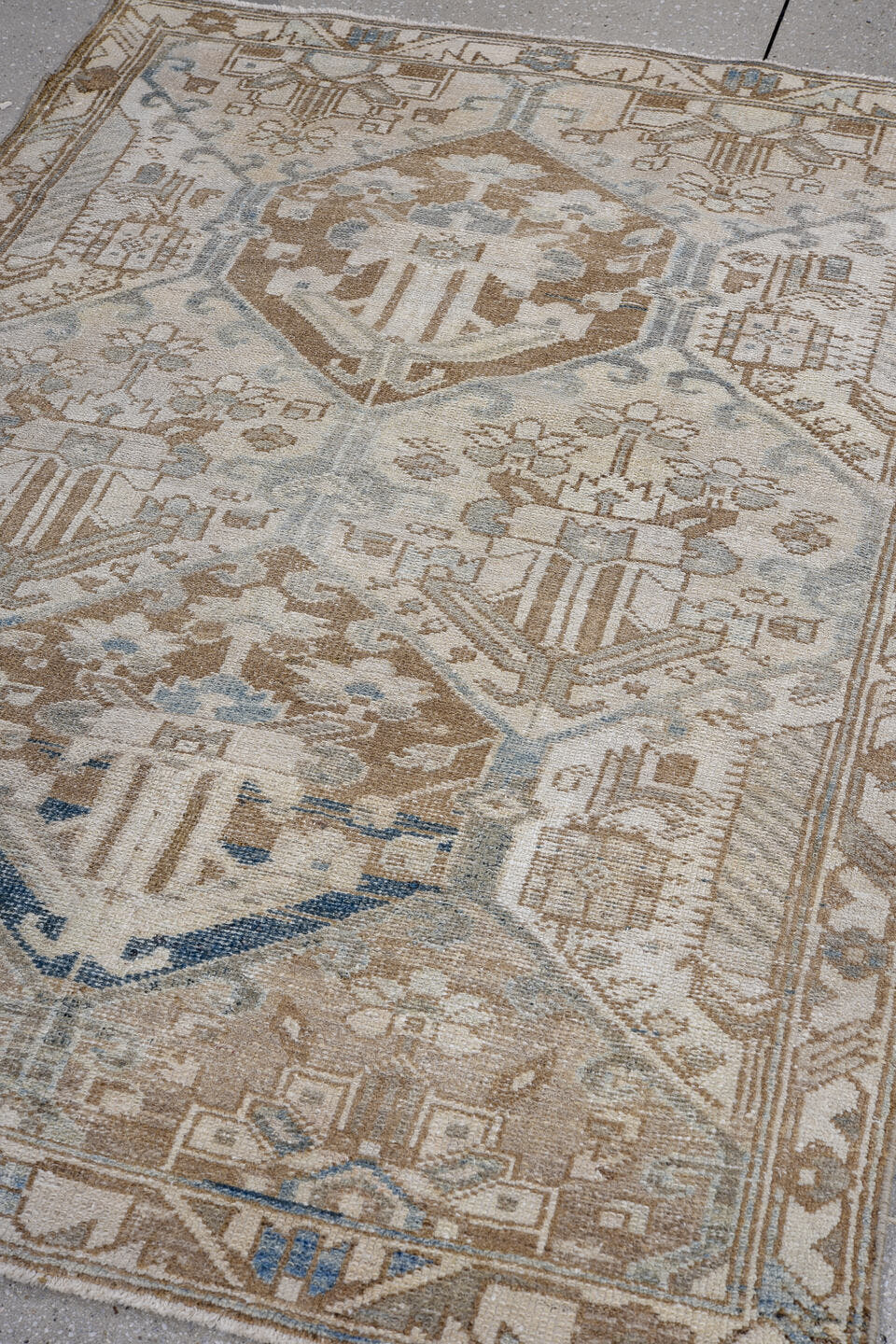 3' x 4' one-of-a-kind handmade antique Baktiary small size rug. Color palette: ivory, camel, taupe, pale blue, brown