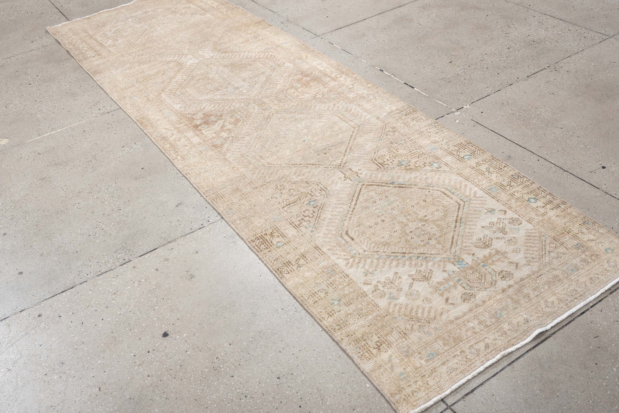 3' x 10' one-of-a-kind handmade antique Sarab runner rug. Color palette: ivory, beige, taupe, camel, pale blue, light brown