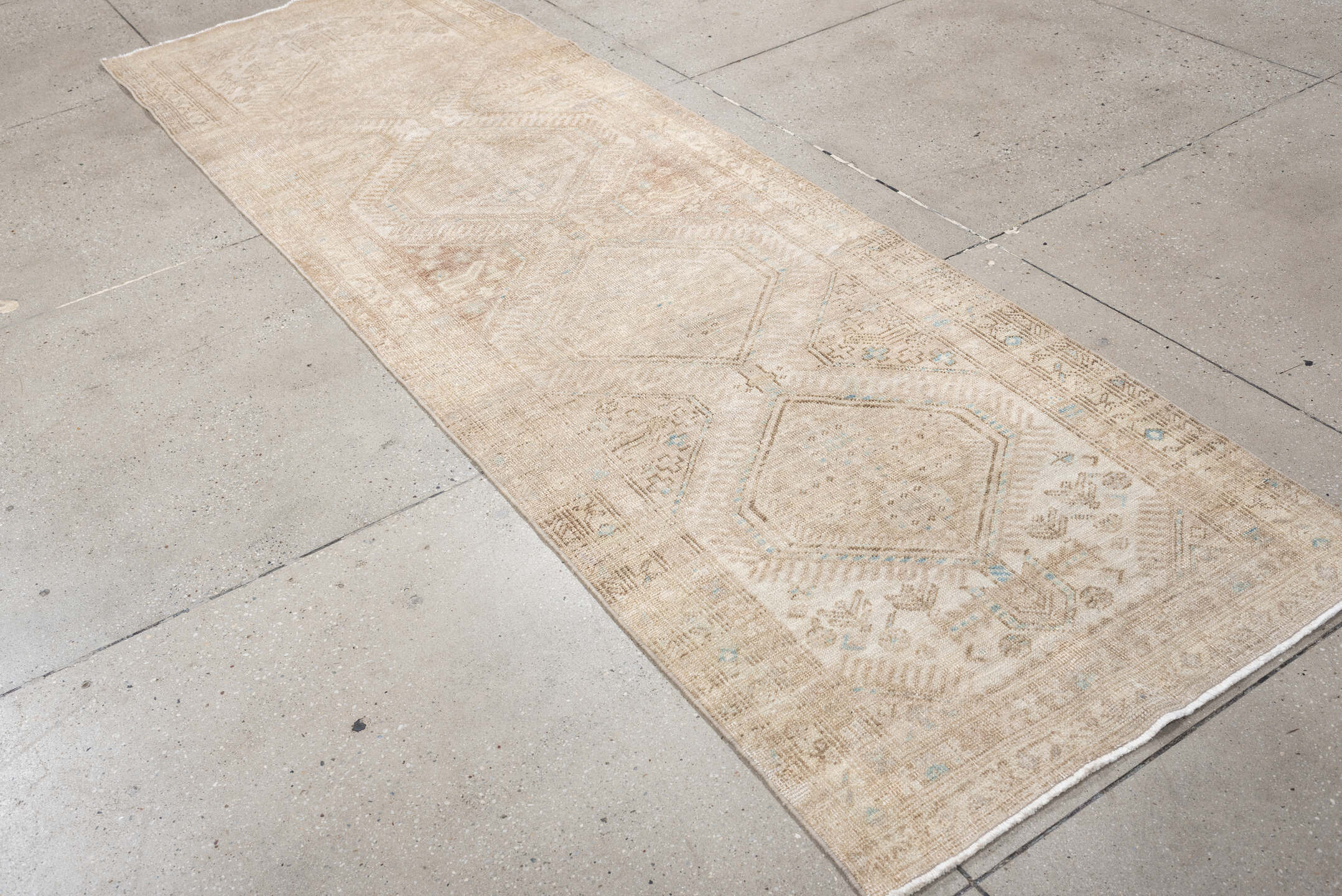 3' x 10' one-of-a-kind handmade antique Sarab runner rug. Color palette: ivory, beige, taupe, camel, pale blue, light brown