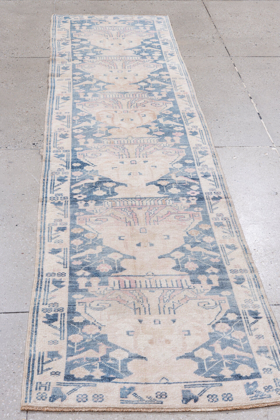 2' x 9' one-of-a-kind handmade antique Anatolian runner rug. Color palette: ivory, pale blue, blush, slate, cream