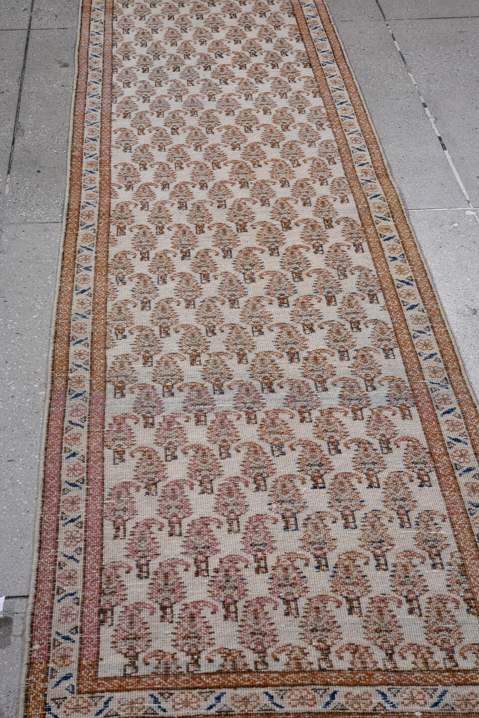 2' x 8' one-of-a-kind handmade antique Tabriz runner rug. Color palette: ivory, rust, camel, blue, rose, taupe, terracotta