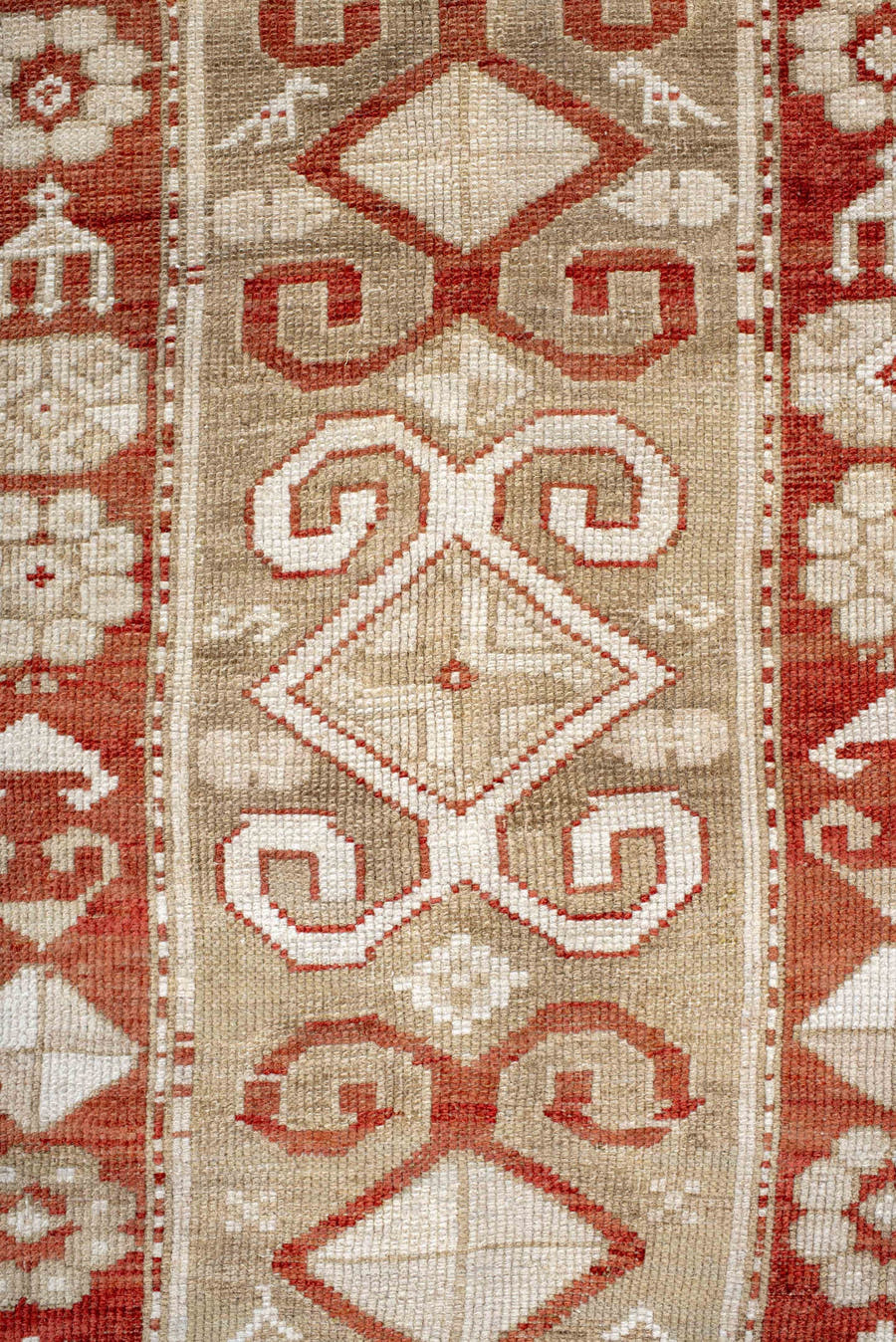 4' x 9' one-of-a-kind handmade antique Caucasian runner rug. Color palette: ivory, rust, camel, brick, beige, terracotta