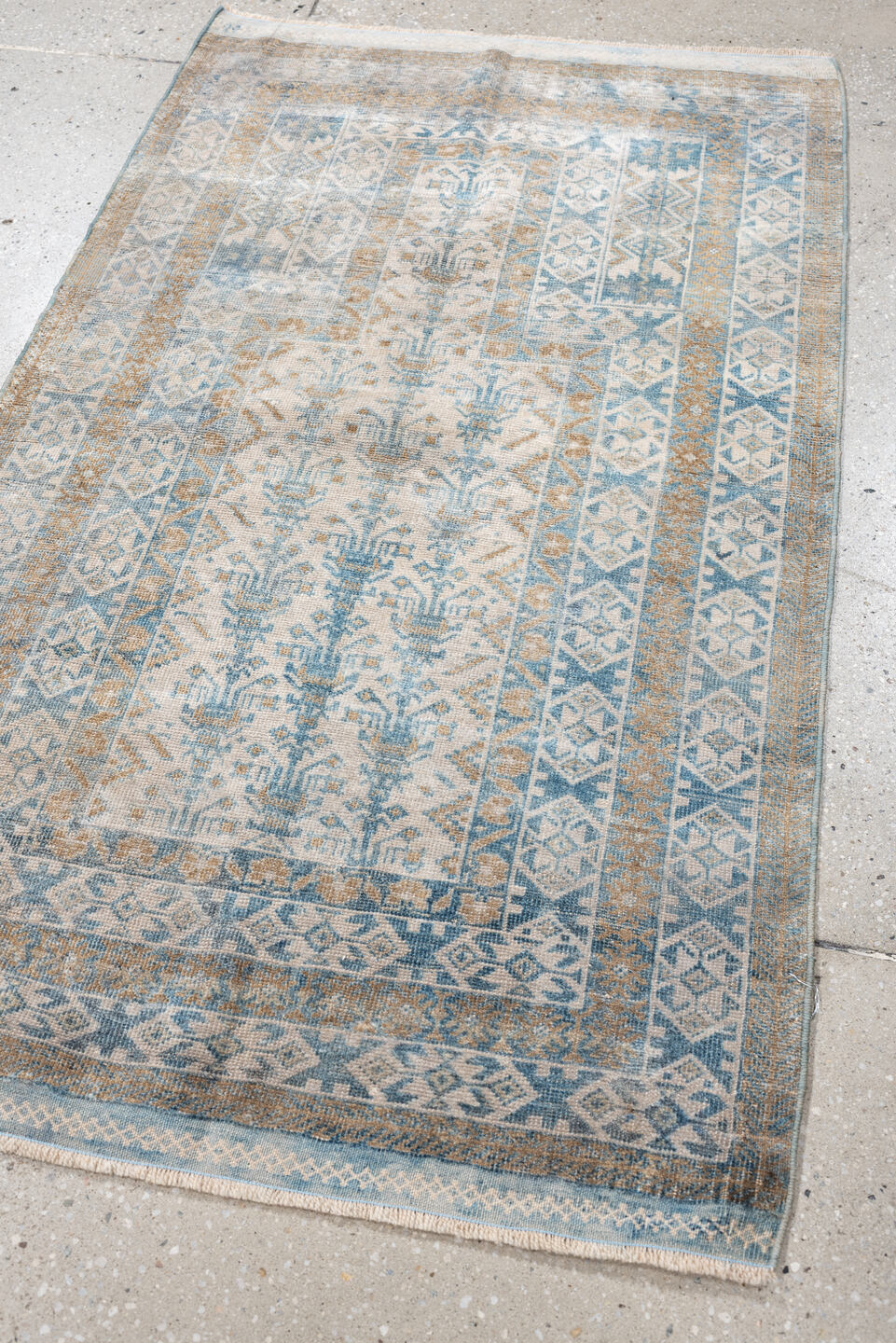 2' x 4' one-of-a-kind handmade antique Belouch small size rug. Color palette: ivory, sky blue, camel, taupe, sand