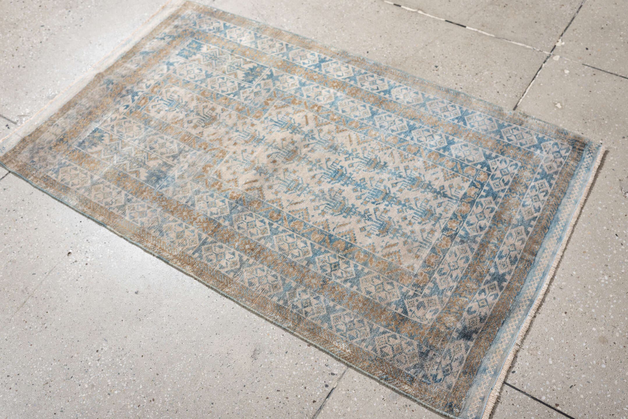 2' x 4' one-of-a-kind handmade antique Belouch small size rug. Color palette: ivory, sky blue, camel, taupe, sand