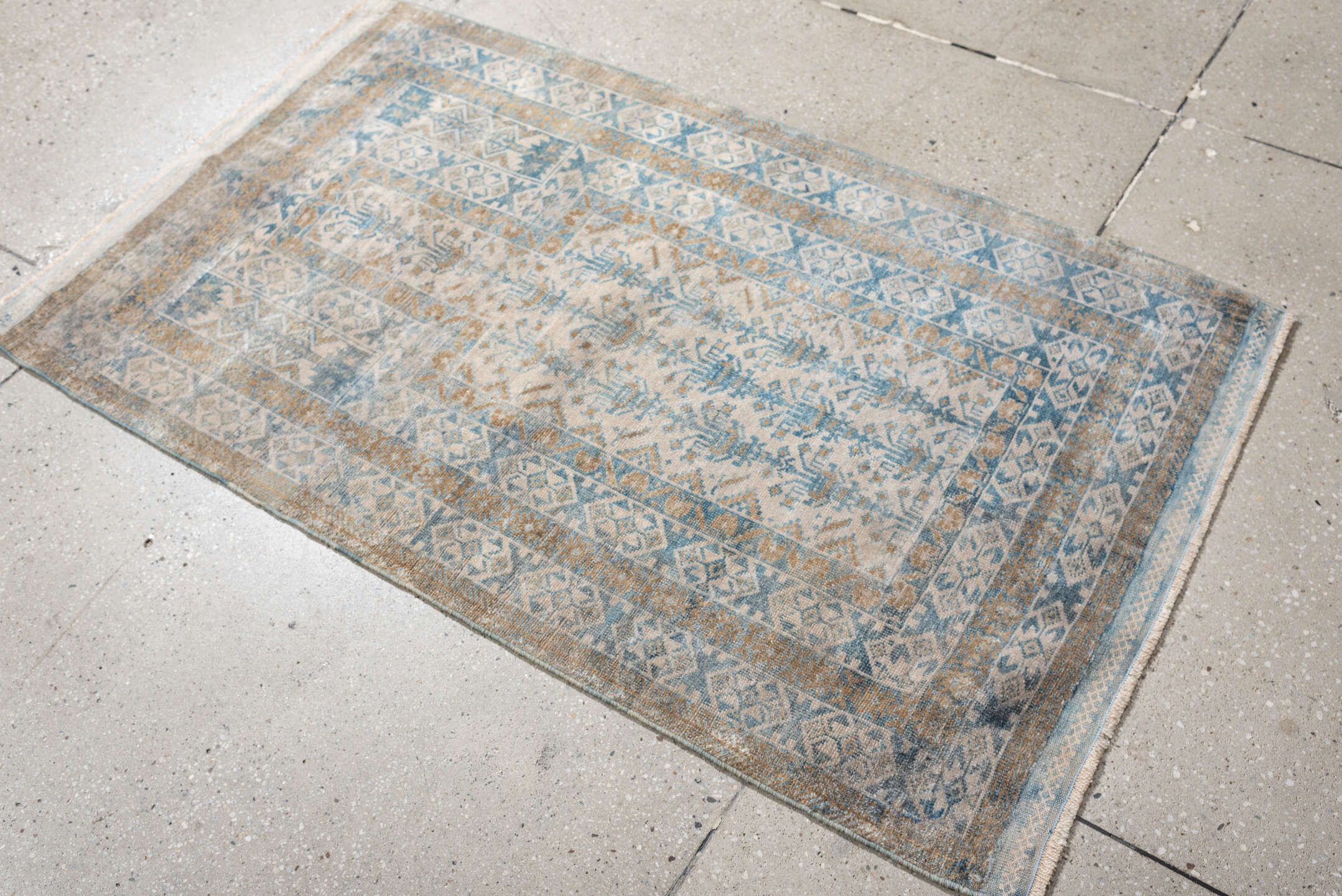 2' x 4' one-of-a-kind handmade antique Belouch small size rug. Color palette: ivory, sky blue, camel, taupe, sand