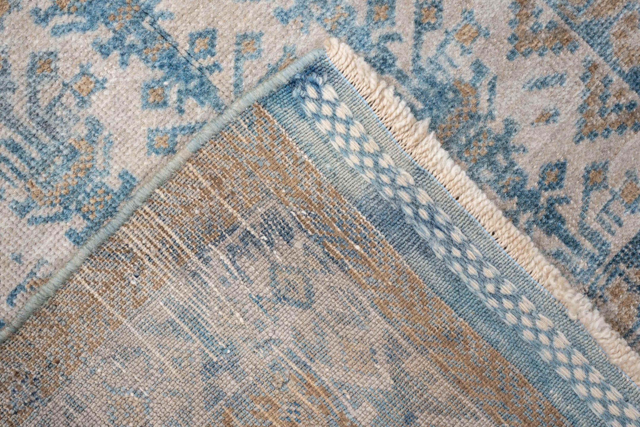 2' x 4' one-of-a-kind handmade antique Belouch small size rug. Color palette: ivory, sky blue, camel, taupe, sand