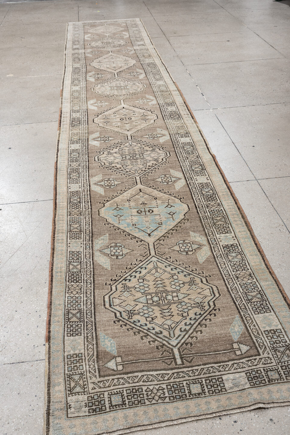 3' x 16' one-of-a-kind handmade vintage runner rug. Color palette: taupe, ivory, pale blue, camel, charcoal, beige, gray