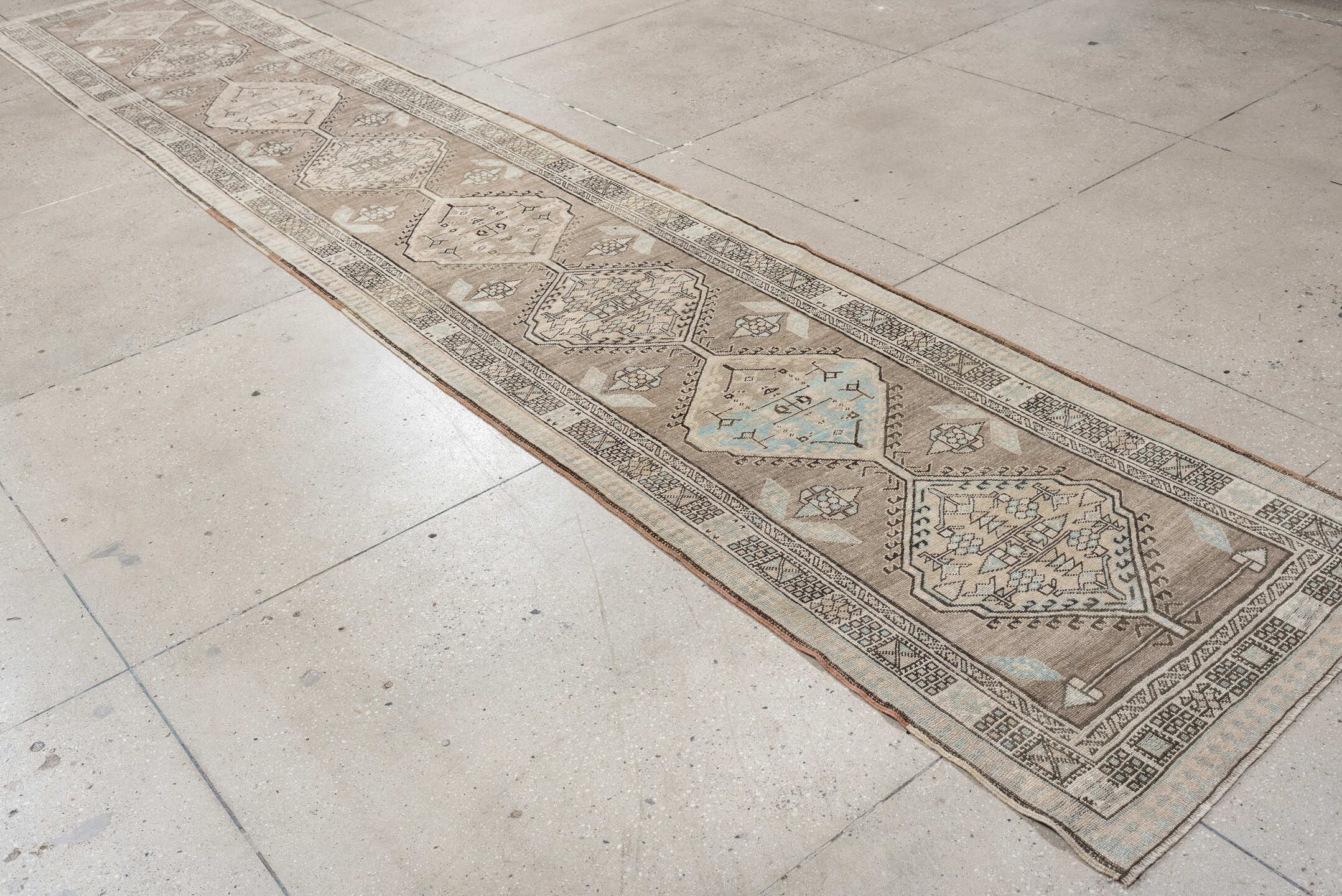 3' x 16' one-of-a-kind handmade vintage runner rug. Color palette: taupe, ivory, pale blue, camel, charcoal, beige, gray