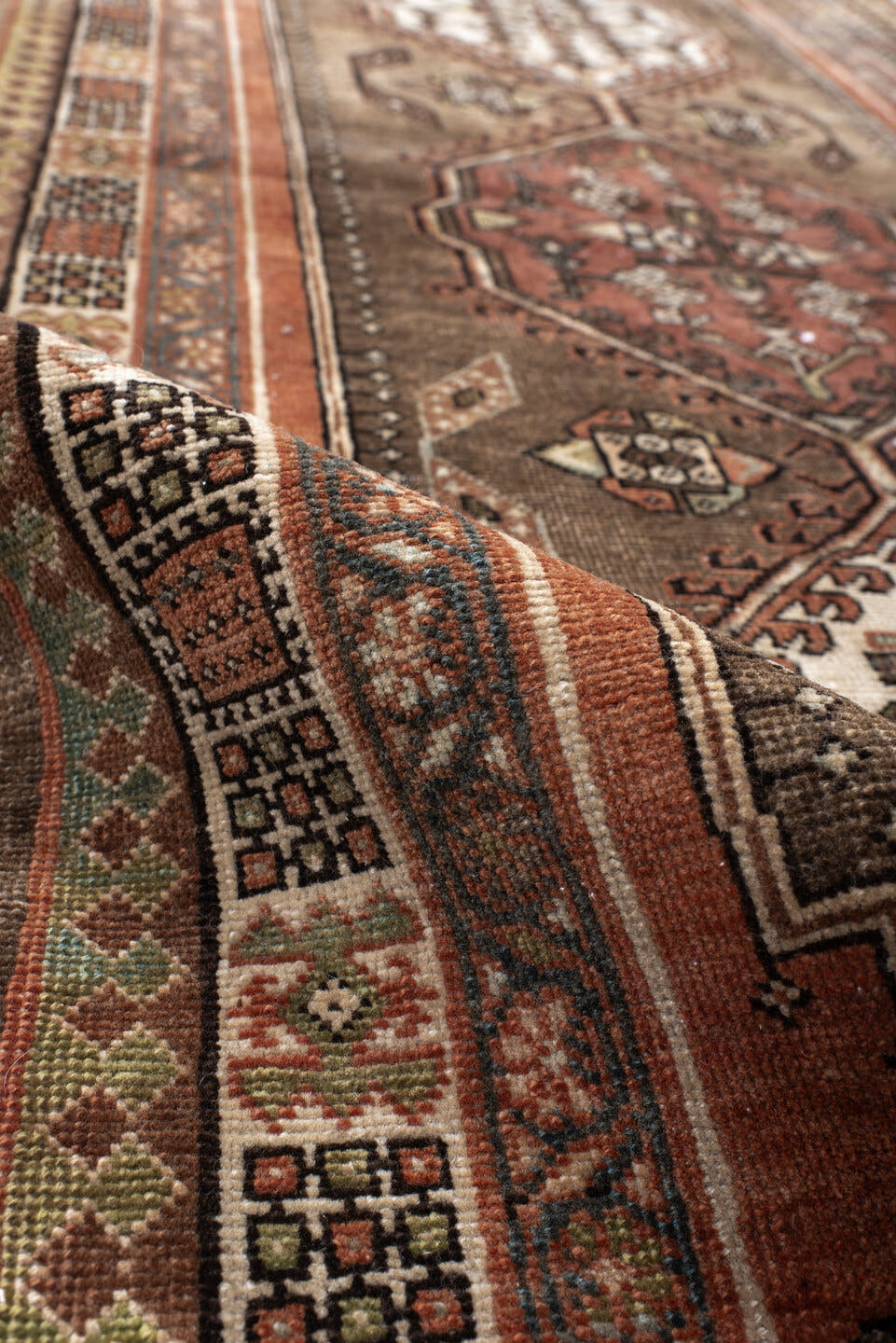 3' x 10' one-of-a-kind handmade antique Sarab runner rug. Color palette: taupe, camel, rust, ivory, brown, sage, slate