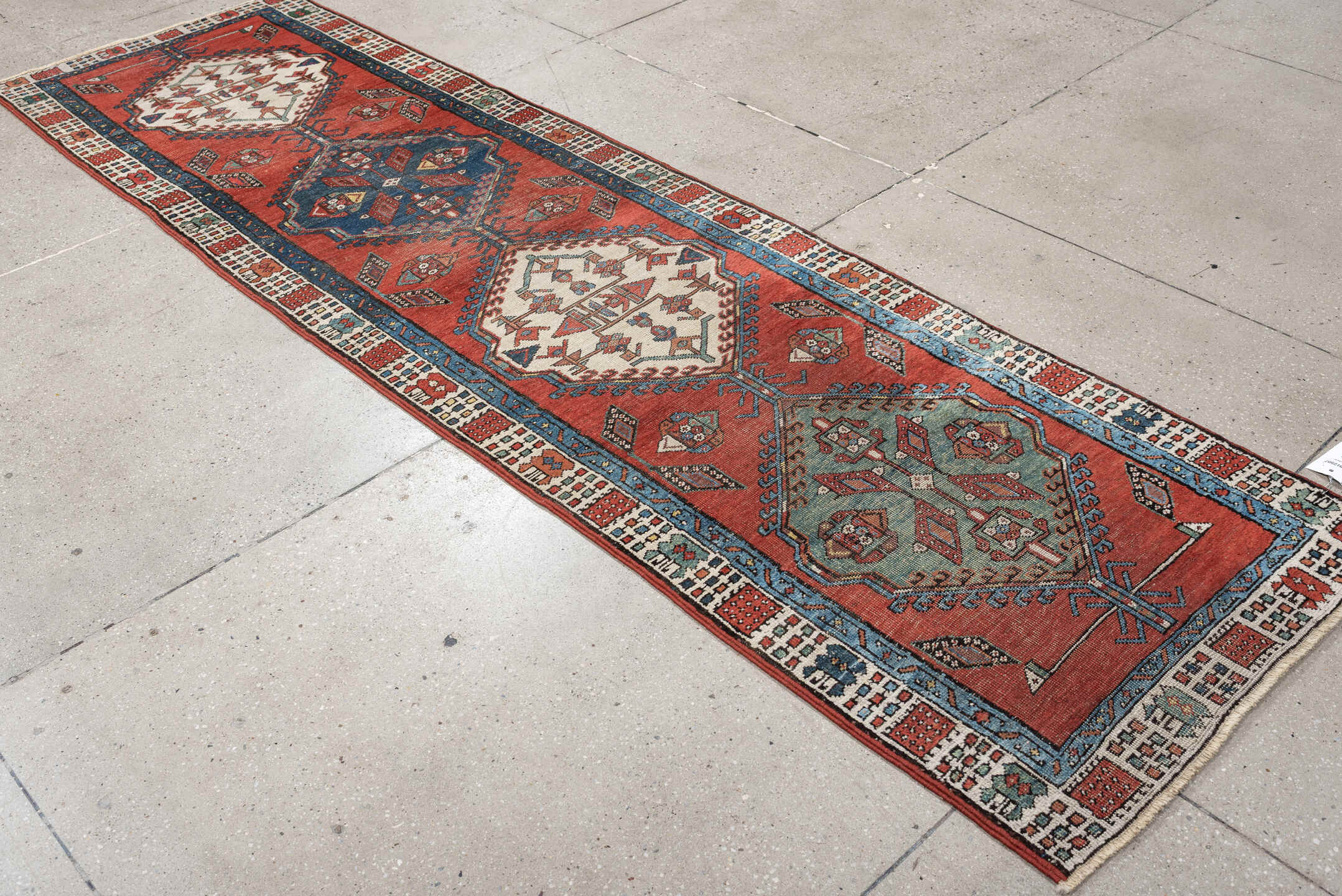2' x 9' one-of-a-kind handmade vintage Saraband runner rug. Color palette: terra cotta, ivory, blue, rust, slate, sage
