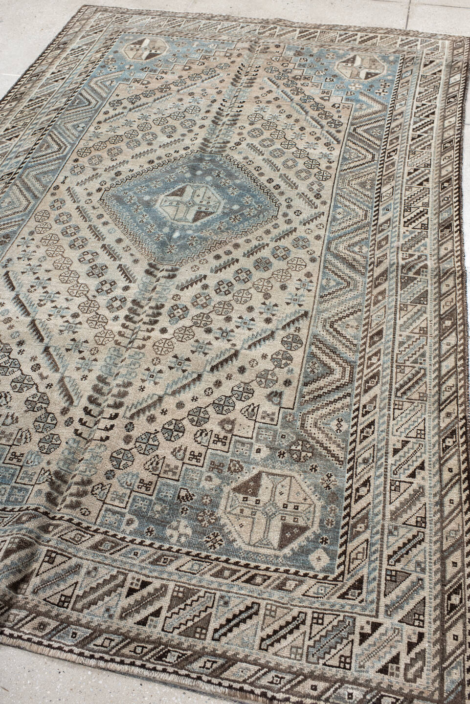 5' x 8' one-of-a-kind handmade vintage Shiraz medium size rug. Color palette: gray, light gray, black, off-white, blue