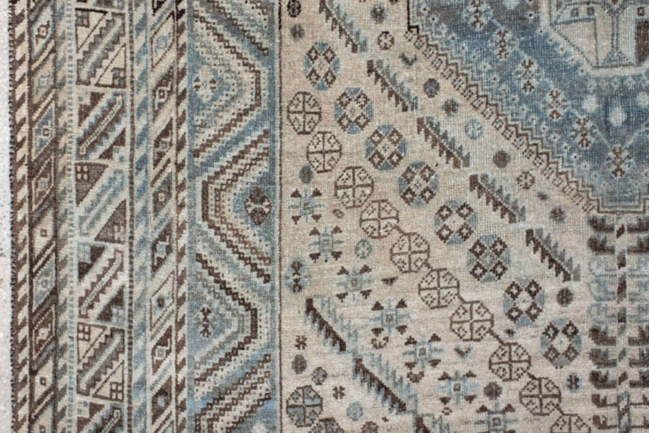 5' x 8' one-of-a-kind handmade antique Shiraz medium size rug. Color palette: ivory, powder blue, brown, charcoal, taupe