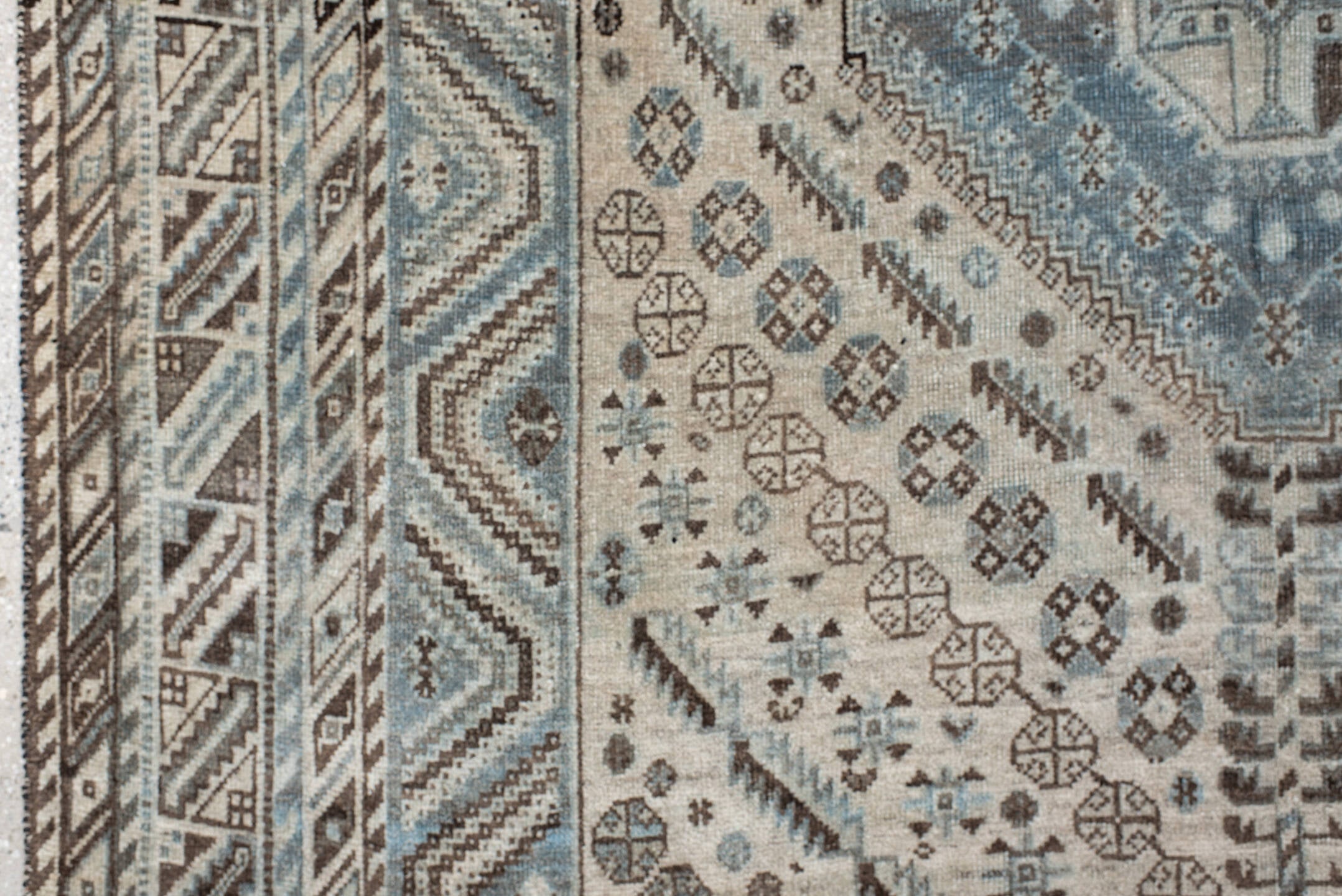 5' x 8' one-of-a-kind handmade antique Shiraz medium size rug. Color palette: ivory, powder blue, brown, charcoal, taupe
