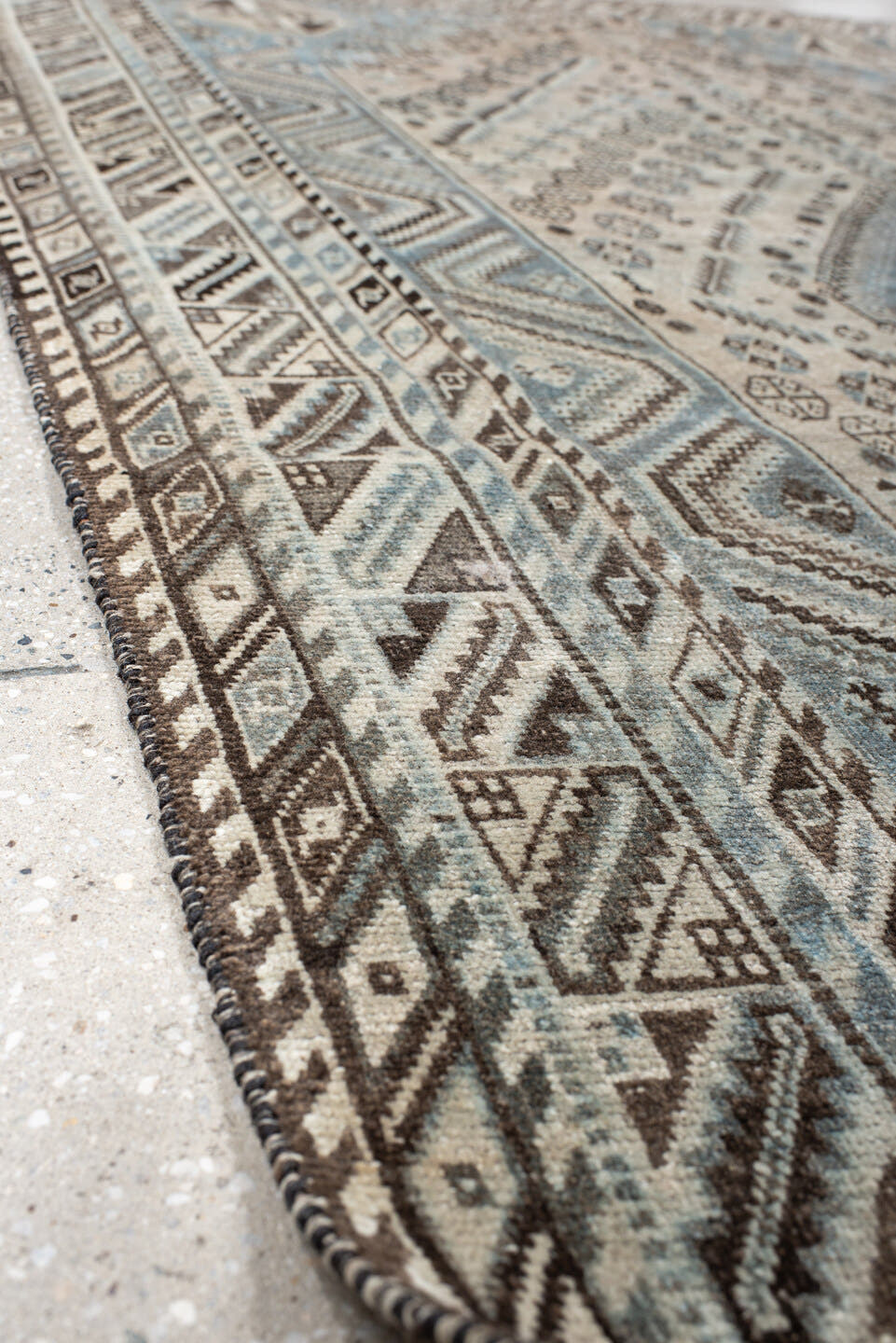 5' x 8' one-of-a-kind handmade antique Shiraz medium size rug. Color palette: ivory, powder blue, brown, charcoal, taupe
