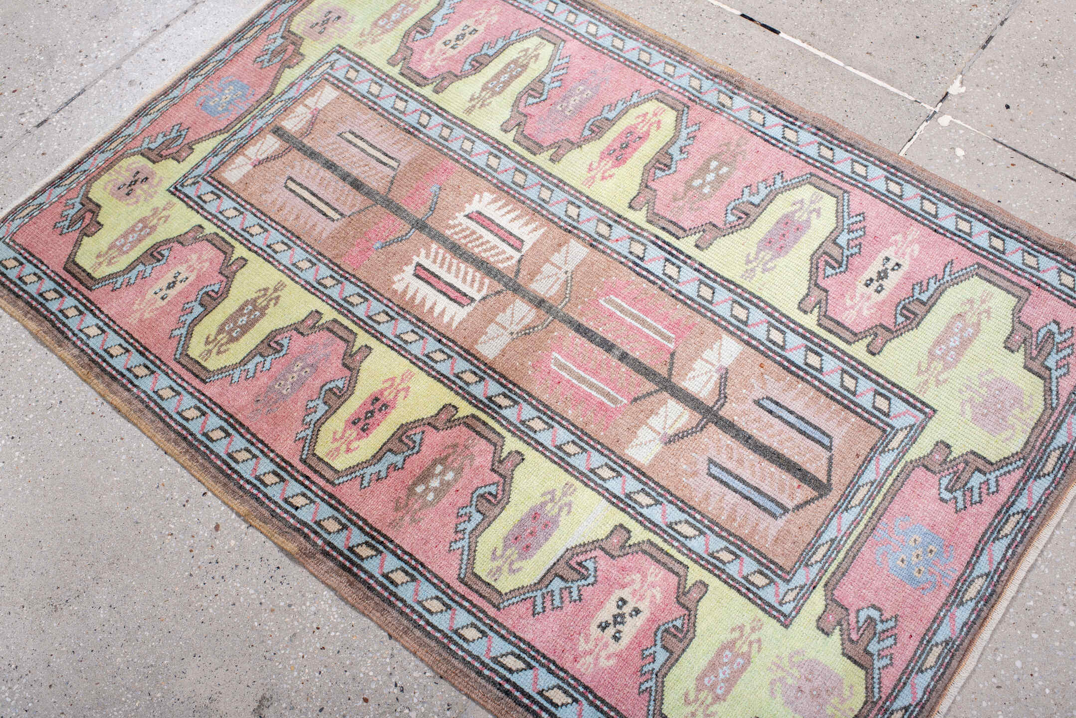 2' x 4' one-of-a-kind handmade antique Anatolian small size rug. Color palette: blush, pale_yellow, sky_blue, brown, ivory