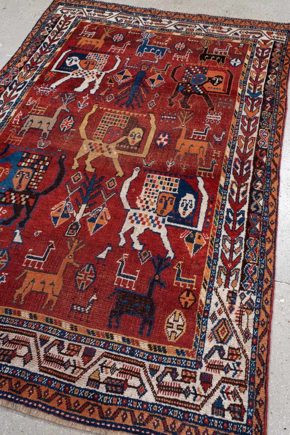 4' x 6' one-of-a-kind handmade antique Shiraz small size rug. Color palette: rust, ivory, navy, coral, camel, indigo, black