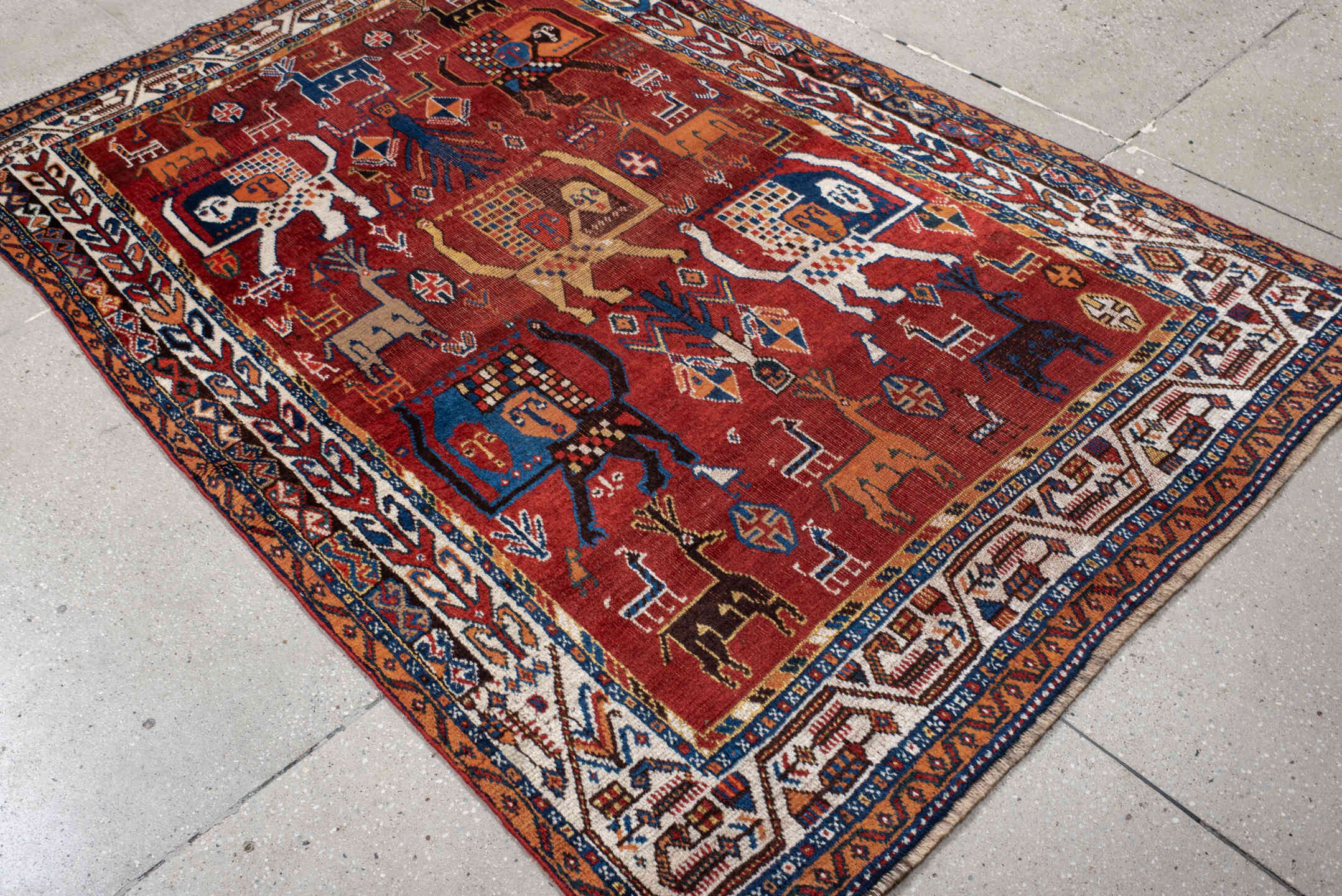4' x 6' one-of-a-kind handmade antique Shiraz small size rug. Color palette: rust, ivory, navy, coral, camel, indigo, black