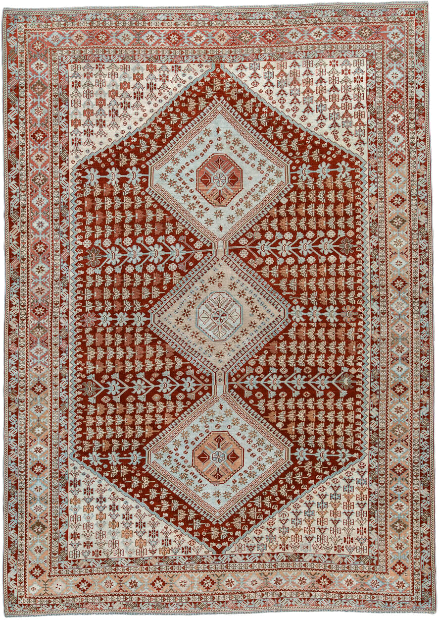 6' x 9' one-of-a-kind handmade antique Shiraz medium size rug. Color palette: rust, ivory, terra cotta, camel, light blue