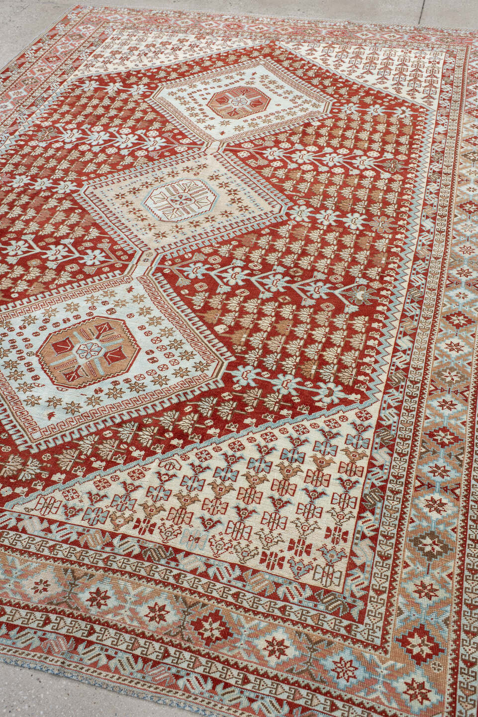6' x 9' one-of-a-kind handmade antique Shiraz medium size rug. Color palette: rust, ivory, terra cotta, camel, light blue