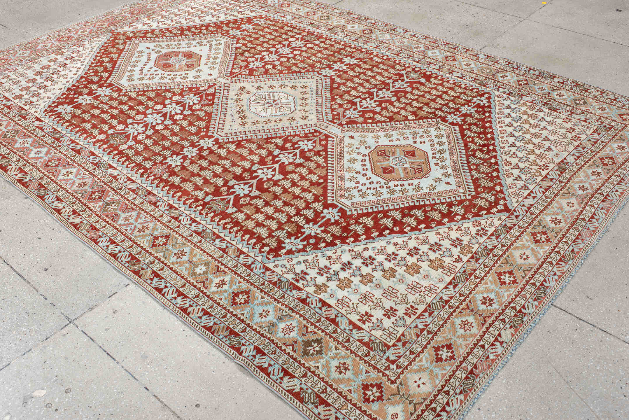 6' x 9' one-of-a-kind handmade antique Shiraz medium size rug. Color palette: rust, ivory, terra cotta, camel, light blue