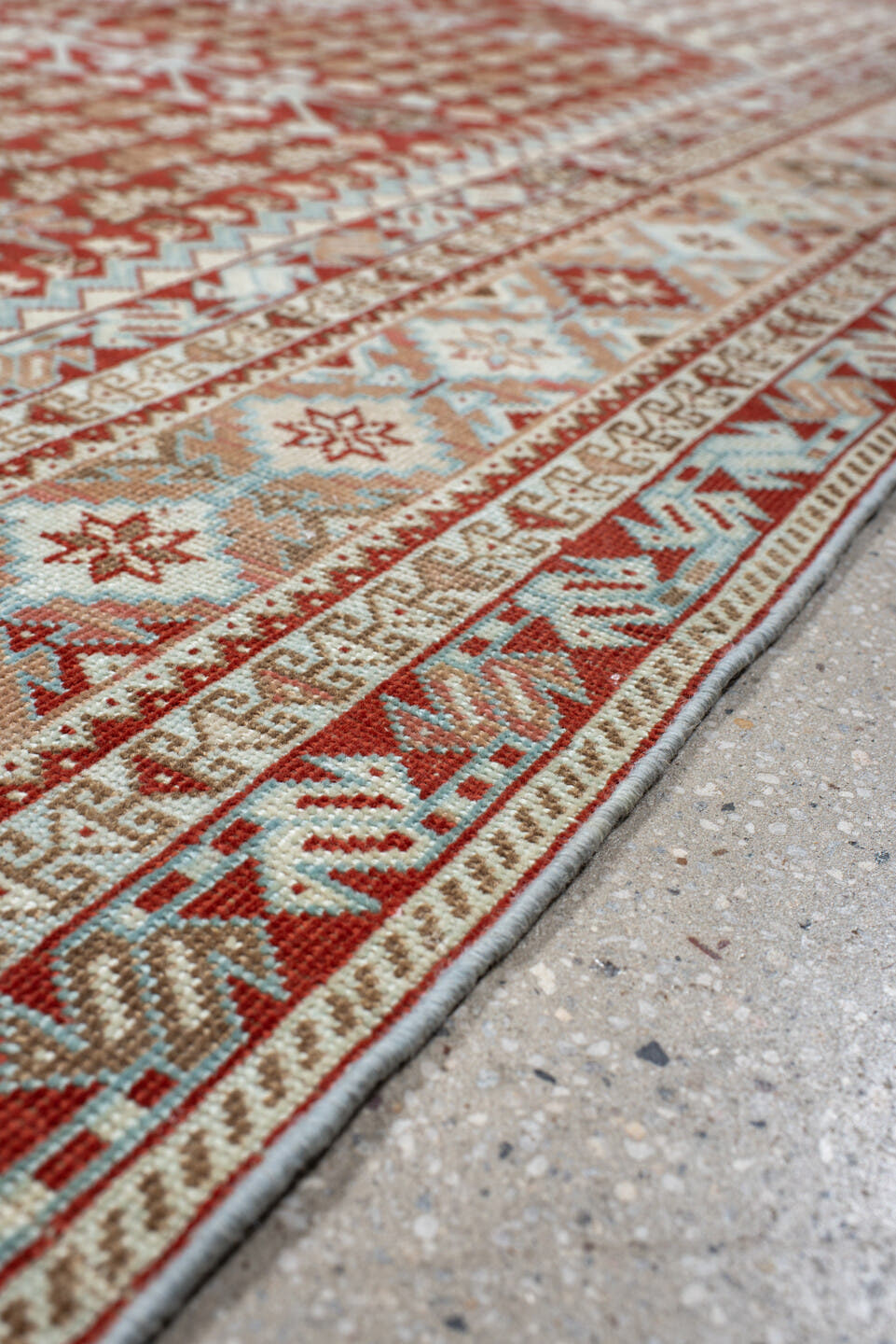 6' x 9' one-of-a-kind handmade antique Shiraz medium size rug. Color palette: rust, ivory, terra cotta, camel, light blue